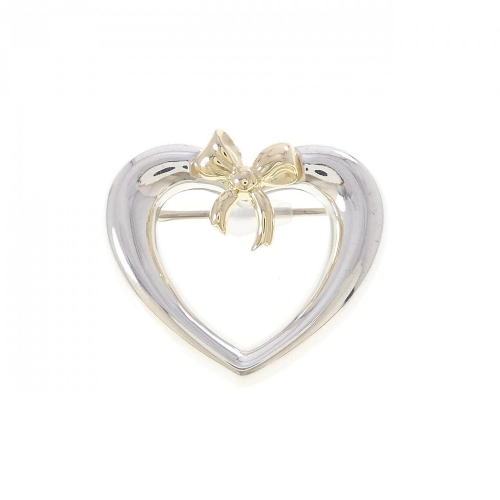 TIFFANY Brooch Silver 925 Yellow Gold (18K): TIFFANY Brooch Silver 925 Yellow Gold (18K) Silver 925 and 18K yellow gold come together in this elegant brooch, measuring 2.38cm x 2.7cm. Like new, with only the faintest traces of wear, this piece i