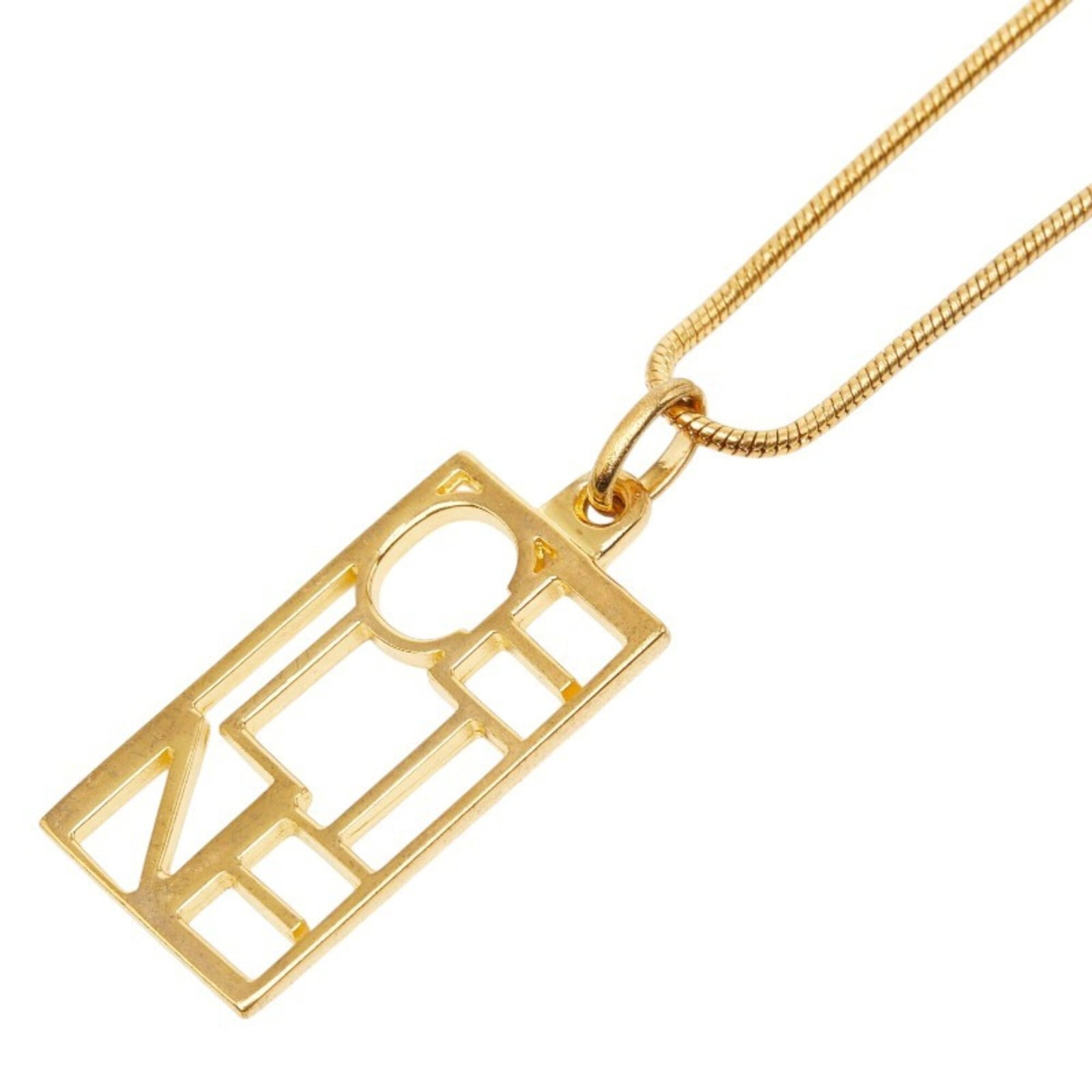 CELINE Gold Necklace: CELINE Gold Necklace Gold Celine Necklace, 55 cm / 21.65'' in circumference, features a 34.1mm x 16mm gold pendant. The necklace is in good used condition with visible scratches, scuffs, and dirt, but
