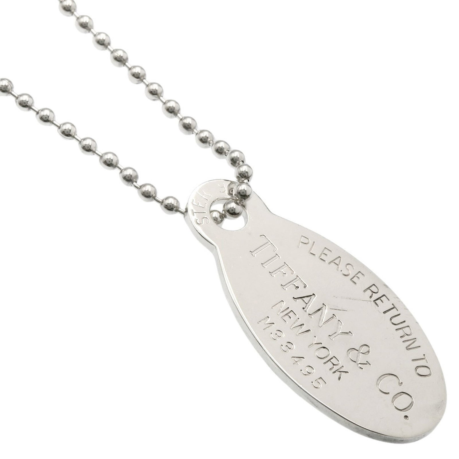TIFFANY Silver Necklace: TIFFANY Silver Necklace Silver necklace from Tiffany, featuring a 42.1mm x 20.5mm pendant, available in a 33.85'' circumference. The necklace is made of silver and bears minor signs of wear,