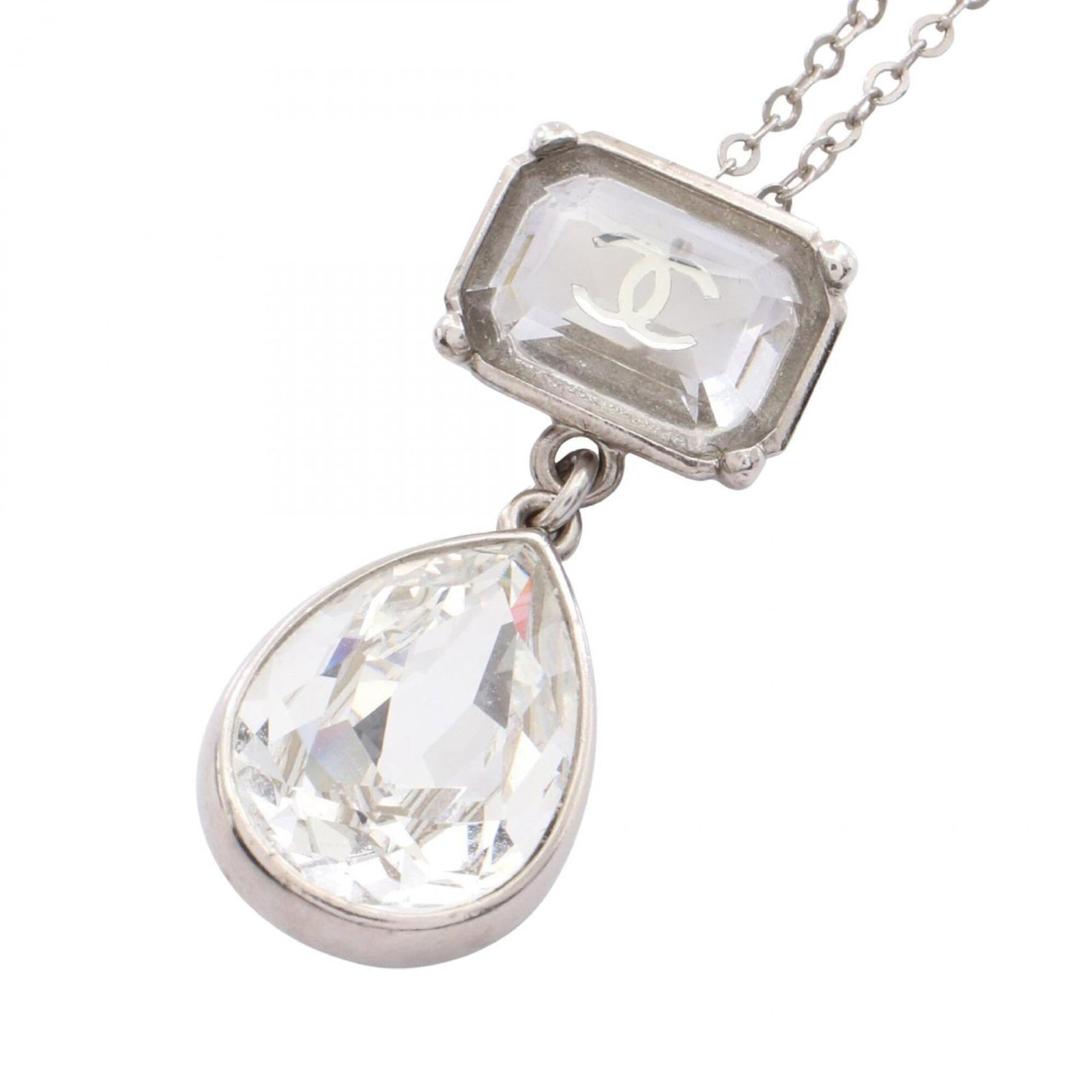 CHANEL Stainless Steel: CHANEL Stainless Steel Stainless steel pendant in clear, silver finish, measuring 33mm x 14mm, suspended from a adjustable chain with a neck circumference of 42 cm - 60 cm. The necklace bears a signat