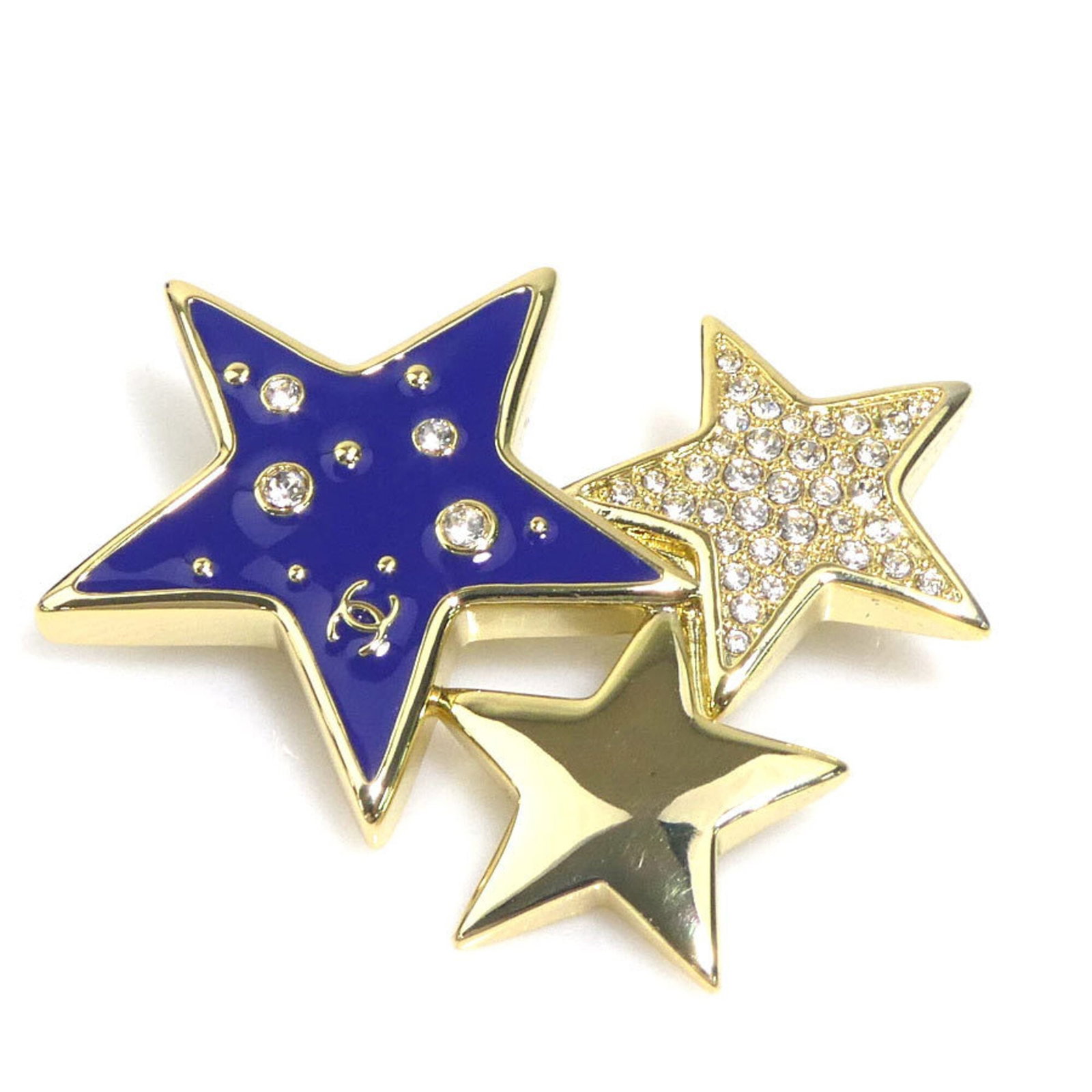 CHANEL Brooch Metal Rhinestone: CHANEL Brooch Metal Rhinestone The CHANEL Brooch Metal Rhinestone boasts a stunning blue, gold, navy, or silver finish, set against a backdrop of intricate metalwork and sparkling rhinestones. This be