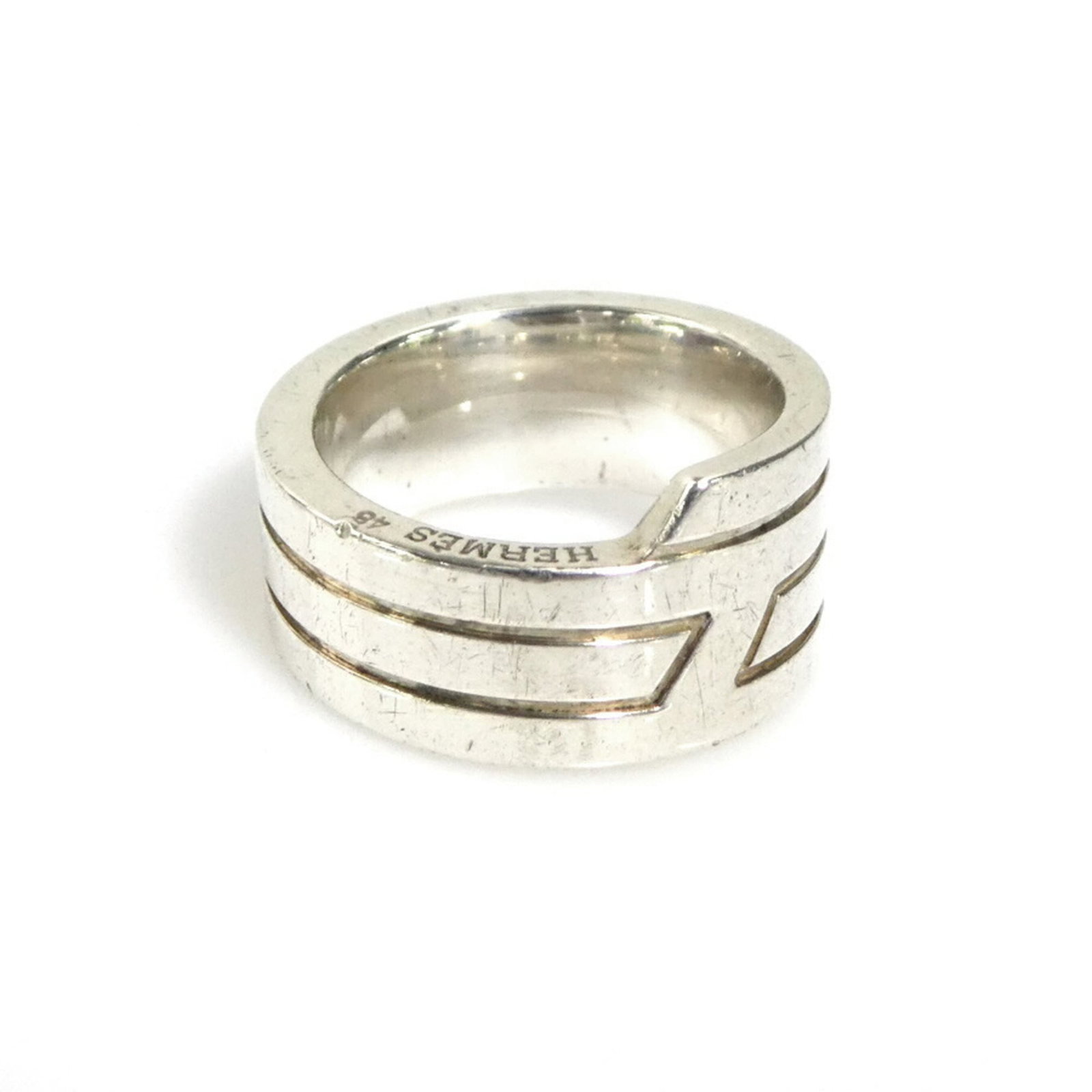 HERMES Band Ring Silver 925: HERMES Band Ring Silver 925 Silver 925 band ring from the renowned French fashion house Hermes, bearing a visible signature. This 4.5 US size band ring is made from high-quality silver and is presente