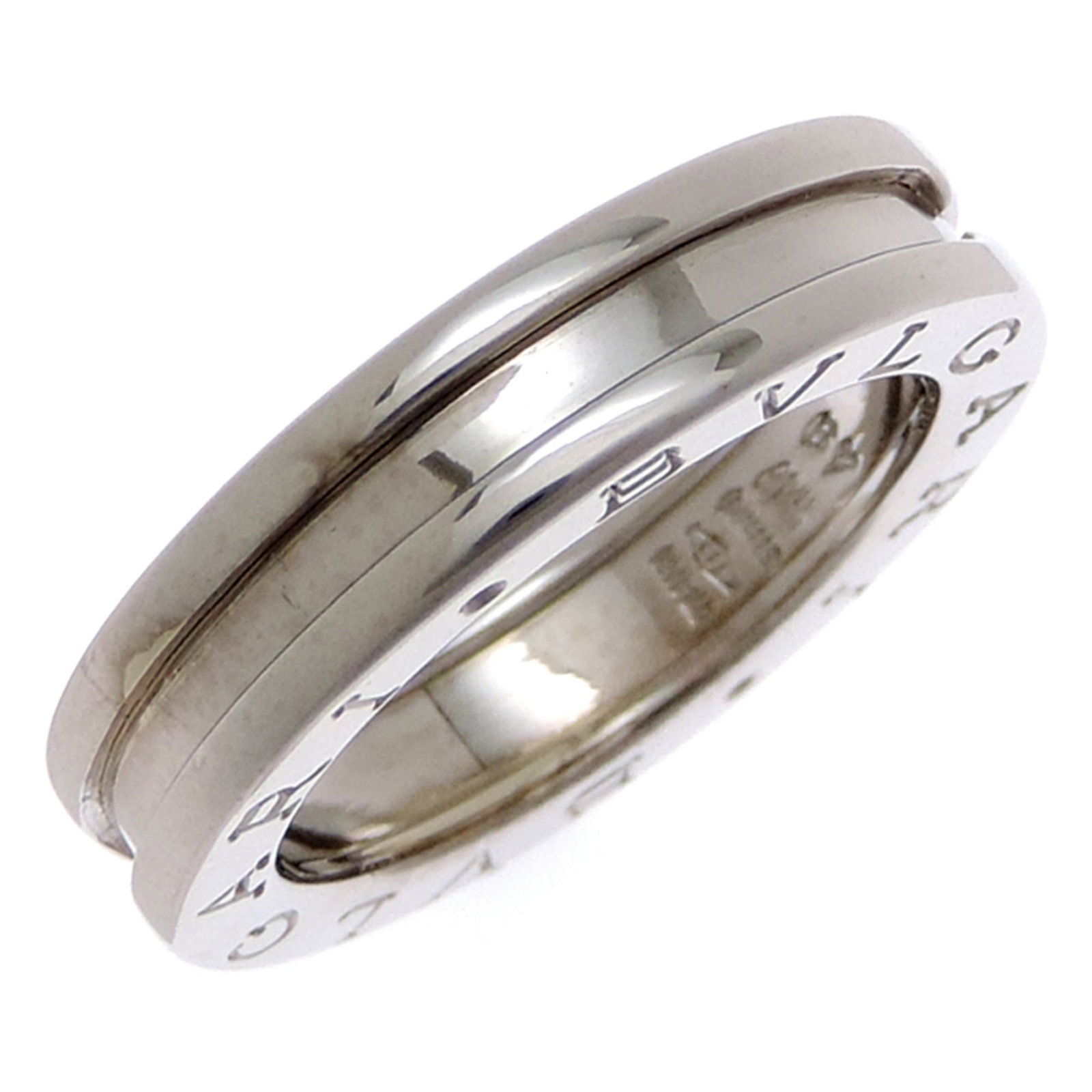 BVLGARI Band Ring White Gold (18K): BVLGARI Band Ring White Gold (18K) Bvlgari Band Ring White Gold (18K) is a women's band ring featuring 18K white gold construction. The ring bears visible wear, including scratches and scuffs, and is