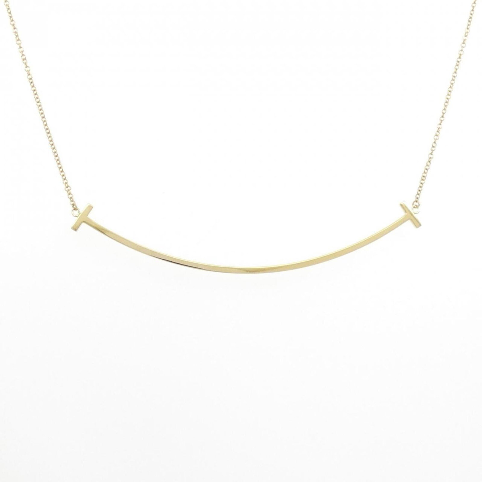 TIFFANY Yellow Gold (18K): TIFFANY Yellow Gold (18K) Yellow gold (18K) pendant from Tiffany, featuring a 5.9mm x 68.4mm pendant size, perfectly complemented by a necklace that fits a 41 cm - 46 cm neck circumference. This like 