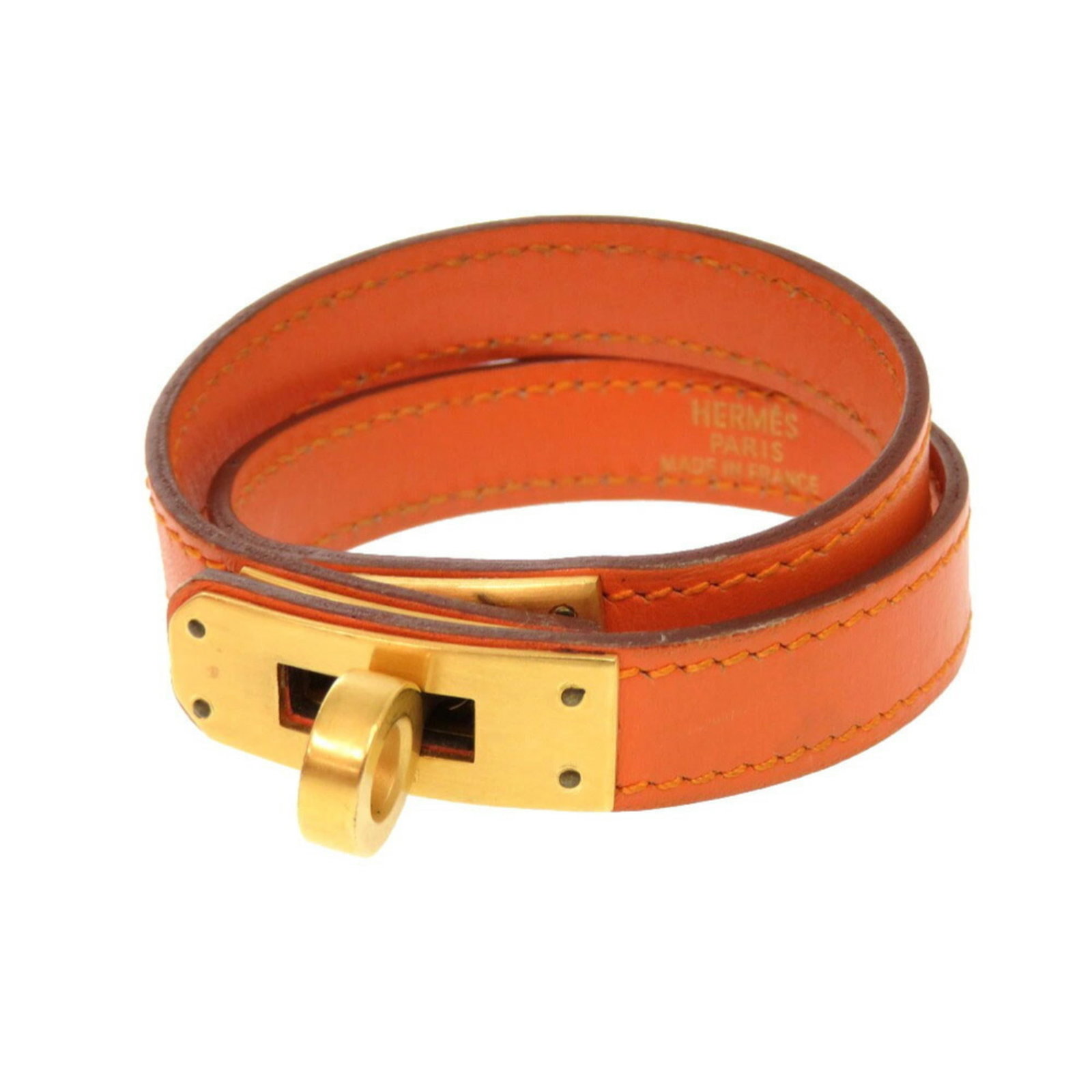 HERMES Charm Bracelet Swift Leather: HERMES Charm Bracelet Swift Leather Swift leather charm bracelet from Herm?s, featuring a gold and orange design, measures 35cm in length. This pre-owned charm bracelet showcases visible wear, includi