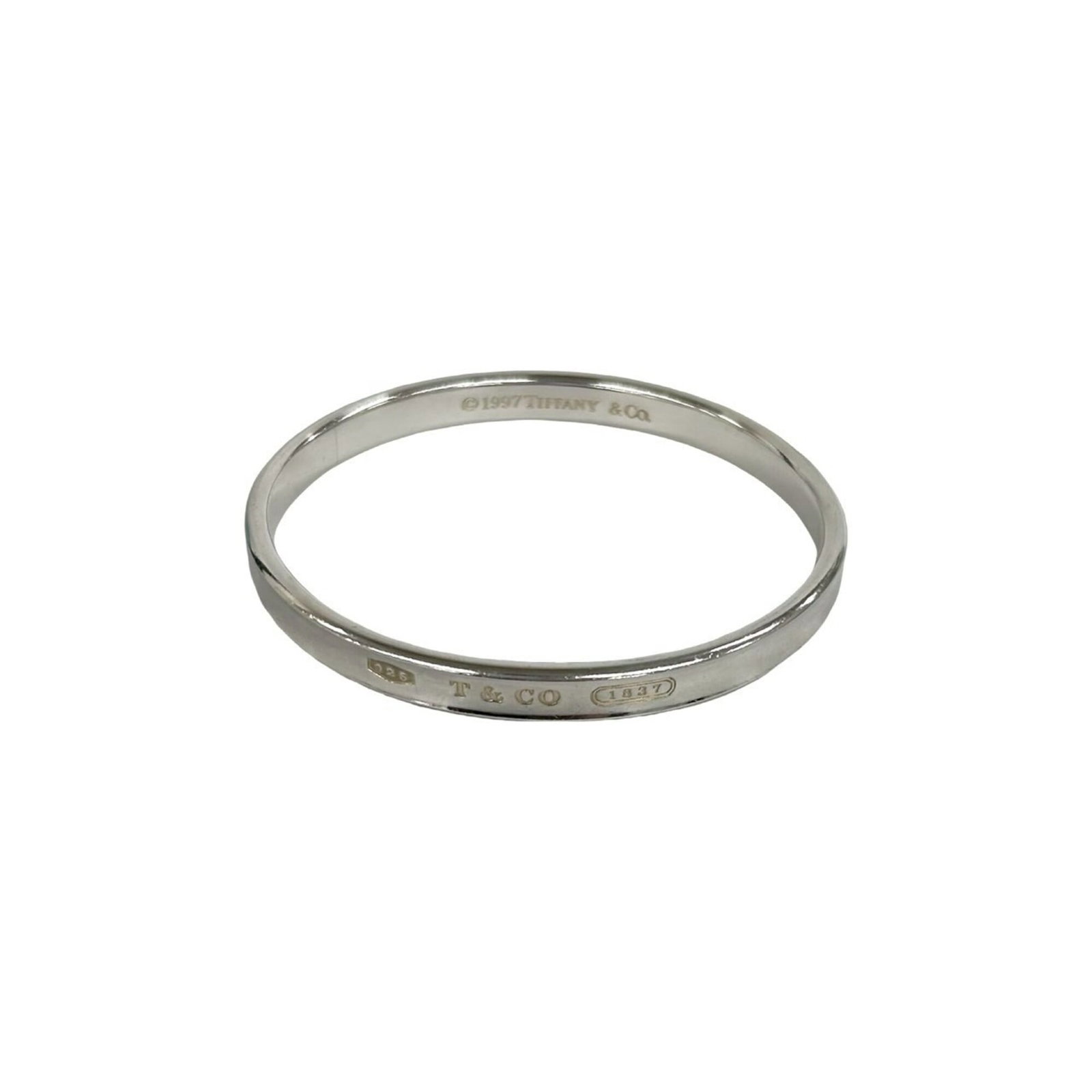 TIFFANY Bangle Silver 925: TIFFANY Bangle Silver 925 Silver 925 bangle from Tiffany, with a length of 18cm and a silver finish. This bangle bears visible signs of wear, including scratches and scuffs, but remains fully function