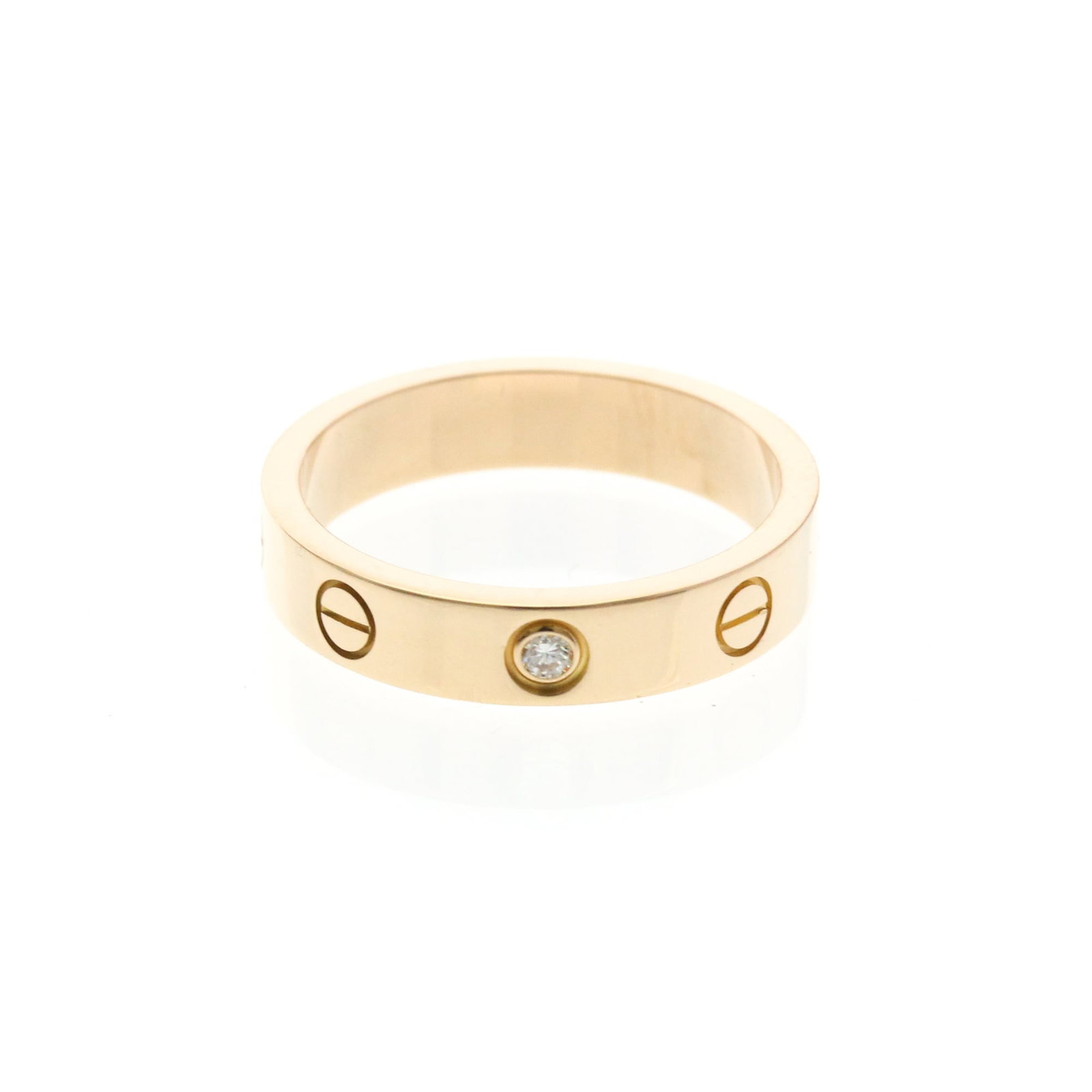 CARTIER Band Ring Pink Gold (18K): CARTIER Band Ring Pink Gold (18K) Pink gold (18K) band ring from Cartier's Mini Love Ring model, featuring a diamond set in a delicate pink gold band. This fashion ring is crafted from 18K gold and me
