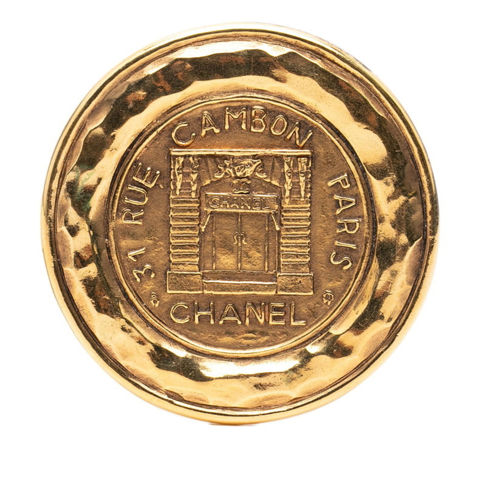 CHANEL Brooch Gold: CHANEL Brooch Gold Gold Brooch by CHANEL, a classic accessory featuring a gold finish and a distinctive design. This used brooch has visible wear, scratches, and scuffs, but remains fully functional