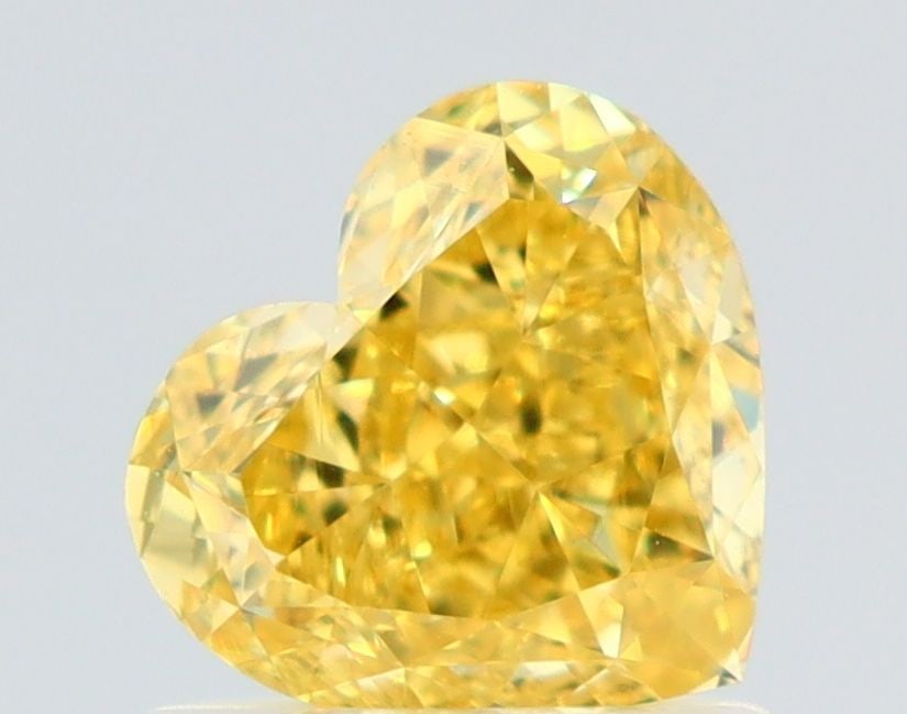 GIA Heart 1.0ct Fancy Intense Yellow VVS2 - Loose Natural Diamond: GIA Heart 1.0ct Fancy Intense Yellow VVS2 - Loose Natural Diamond GIA-certified, this 1.0ct Fancy Intense Yellow VVS2 diamond boasts exceptional clarity and a vibrant, intense yellow color. Measuring