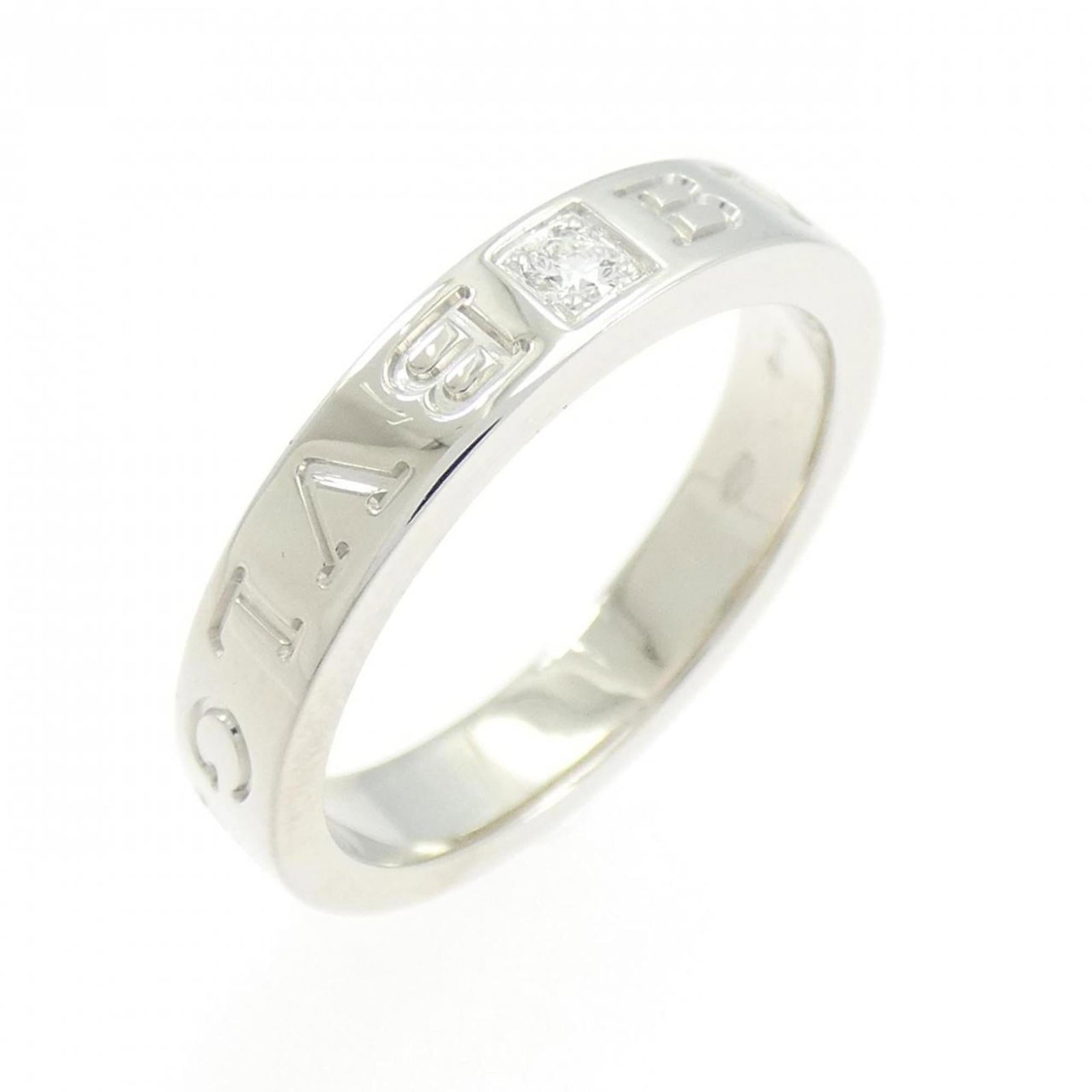 BVLGARI Band Ring White Gold (18K): BVLGARI Band Ring White Gold (18K) Bvlgari Band Ring White Gold (18K) is a gently used, 18K white gold band ring featuring a diamond stone. The ring's minor scratches and light marks are a testament