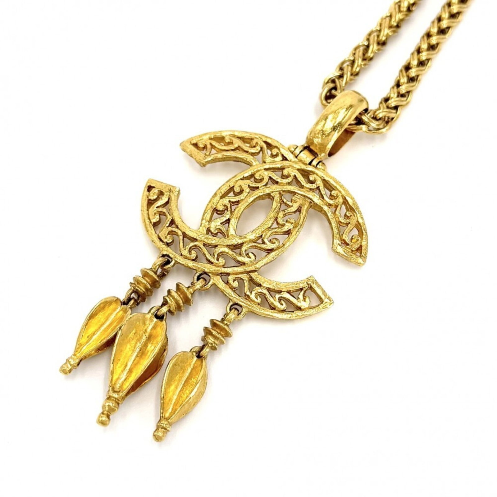 CHANEL Gold Plating: CHANEL Gold Plating Gold plating adds a touch of luxury to this Chanel necklace, featuring a pendant with a 70mm x 45mm design. The item has a gold plating finish and is made from a durable material, 
