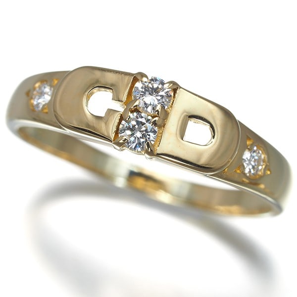 Christian Dior Ring Diamond Logo Us6.5 18K 750 Yellow Gold: Christian Dior Ring Diamond Logo Us6.5 18K 750 Yellow Gold Yellow gold 18K 750 ring features a natural diamond logo, showcasing a diamond set into a 5.0mm wide band. The ring is crafted from 18K