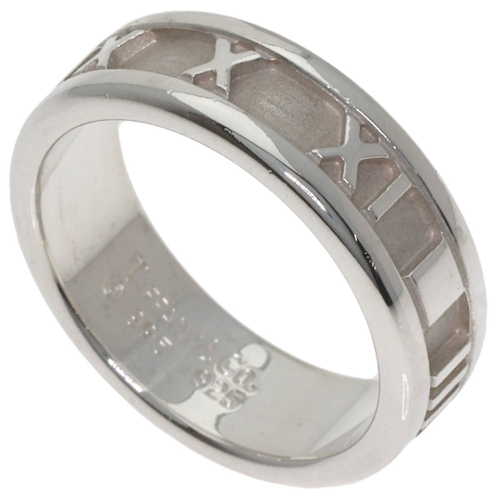 TIFFANY Band Ring Silver: TIFFANY Band Ring Silver Silver band ring from Tiffany's Atlas line, featuring a 6mm wide band with a weight of 5.2g. This gently used ring shows minor signs of wear, including small scratches and lig