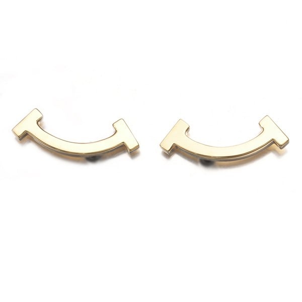 Tiffany&Co. Earrings Tiffany T Smile Mini 18K 750 Yellow Gold: Tiffany&Co. Earrings Tiffany T Smile Mini 18K 750 Yellow Gold Tiffany & Co.'s iconic 18k yellow gold Tiffany T Smile Mini earrings are a masterclass in understated elegance. Crafted from high-quality 