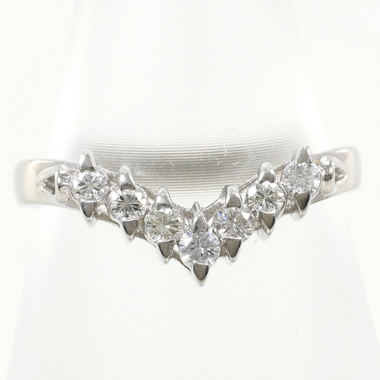 Band Ring Platinum 900: Band Ring Platinum 900 Platinum 900 band ring boasts a sleek, 7mm width and 0.28'' profile, making it a stylish addition to any outfit. This platinum band features a 0.22 carat diamond and is crafted