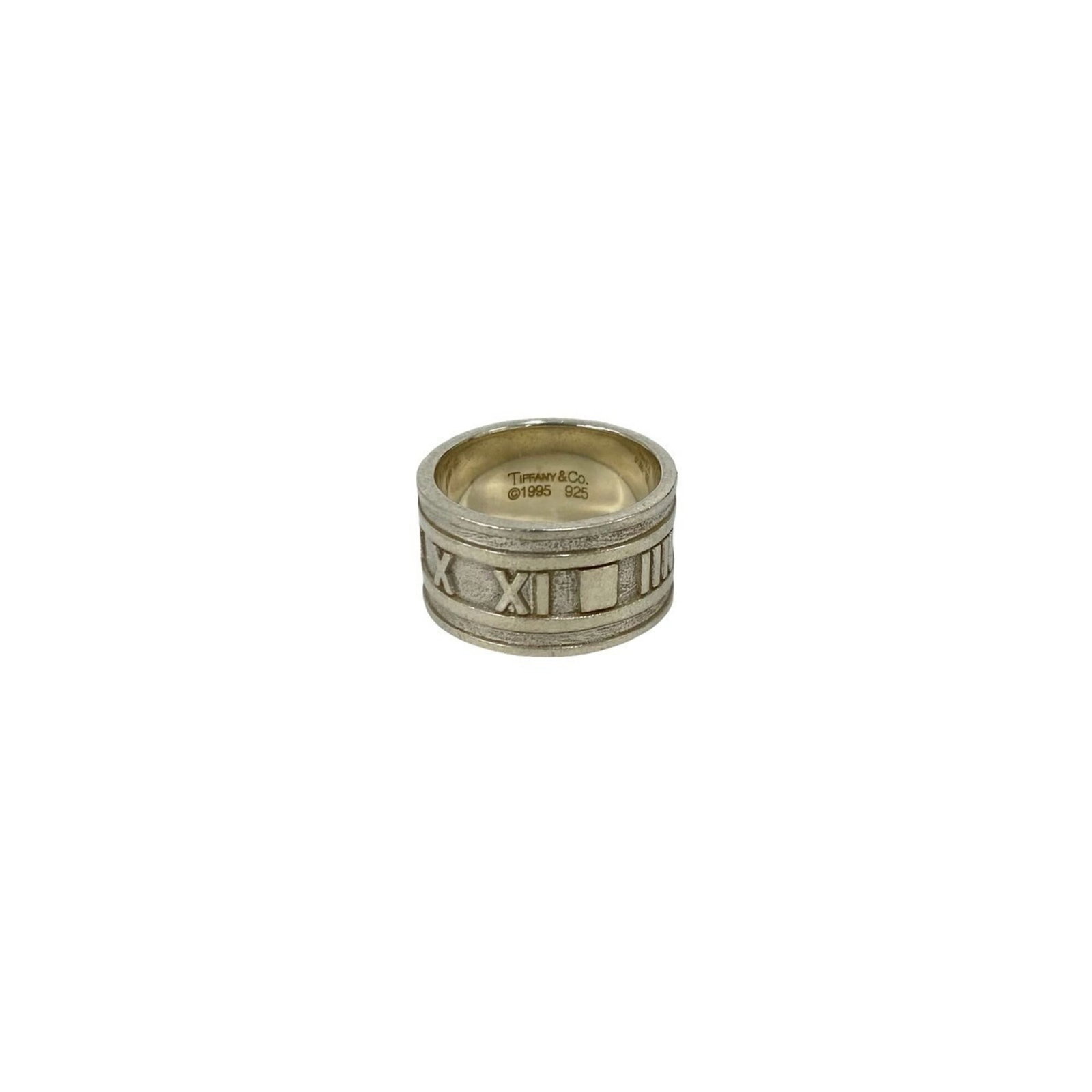 TIFFANY Band Ring Silver 925: TIFFANY Band Ring Silver 925 Silver 925 band ring from Tiffany features a sleek, modern design. The ring bears visible signs of wear, including scratches and scuffs, but remains fully functional.