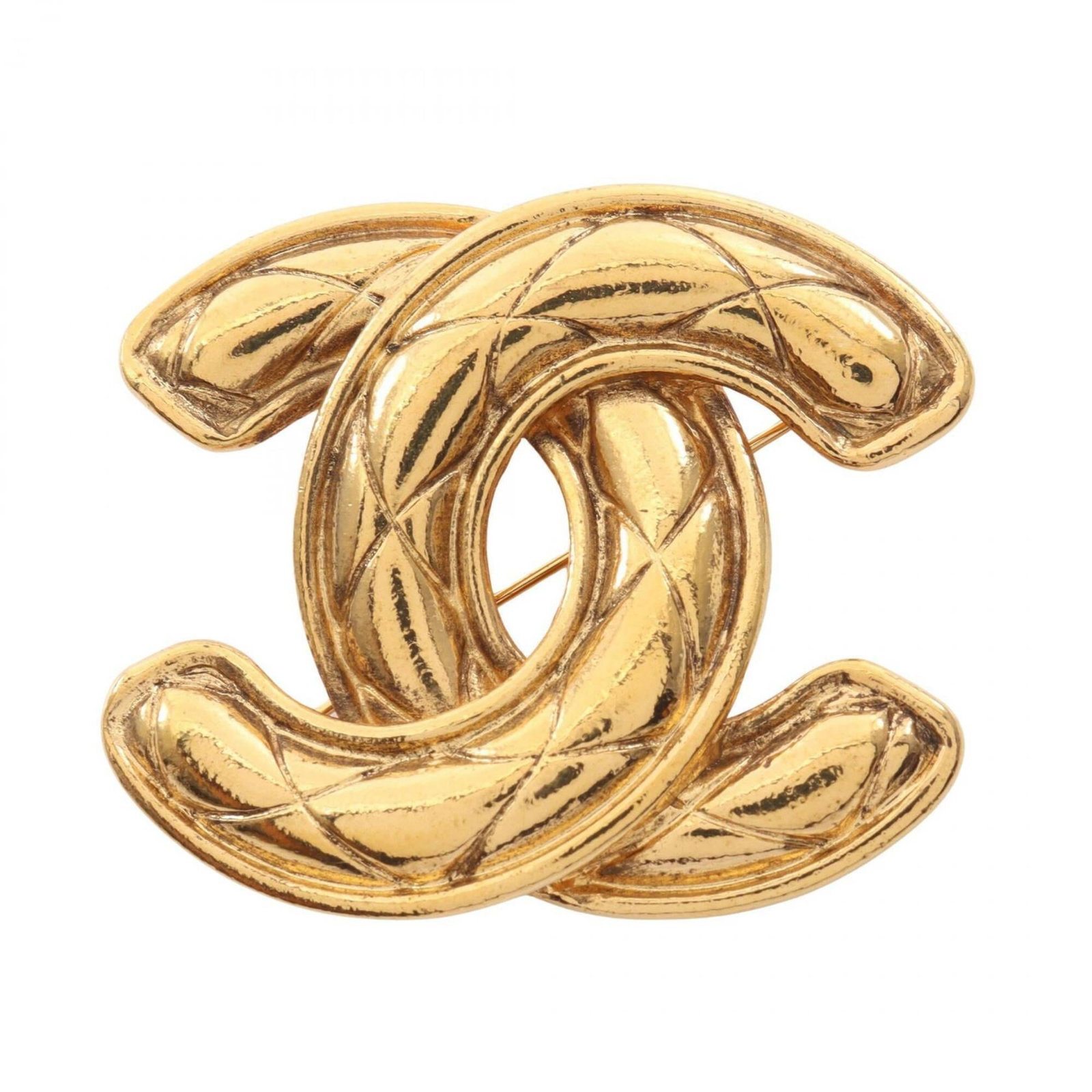 CHANEL Brooch Gold Plating: CHANEL Brooch Gold Plating Gold plating adds a touch of luxury to this Chanel brooch, a timeless piece that still shines with its subtle wear and scratches. The brooch bears a signature, a testament t