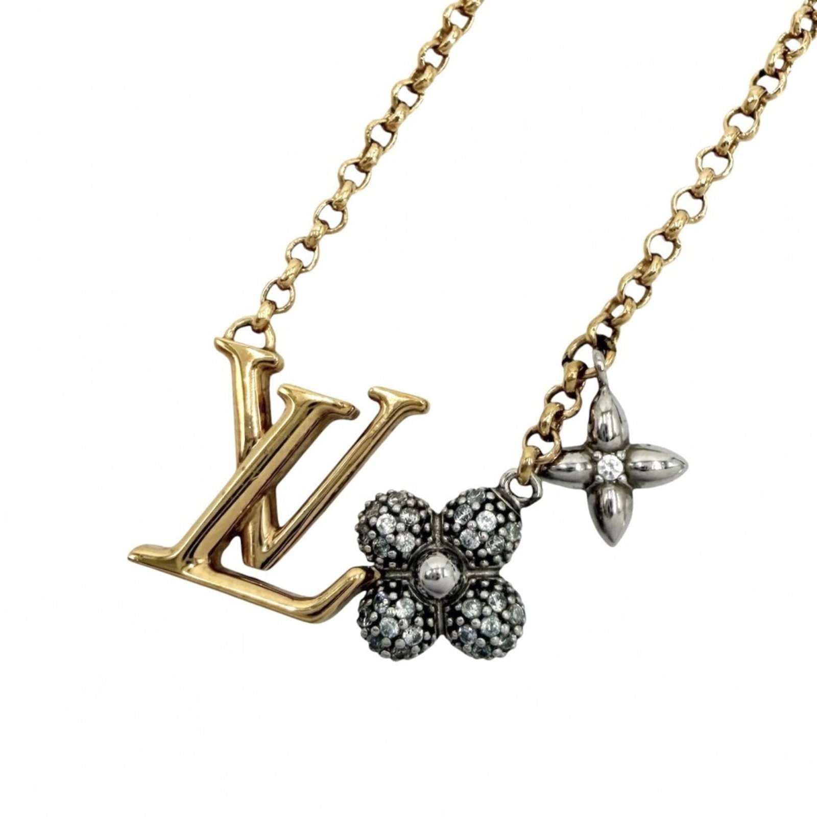 LOUIS VUITTON Gold Silver: LOUIS VUITTON Gold Silver Gold and silver accents add a touch of luxury to this Louis Vuitton necklace, featuring a pendant with a 11mm x 19mm design. The necklace's 47 cm circumference is adjustable,