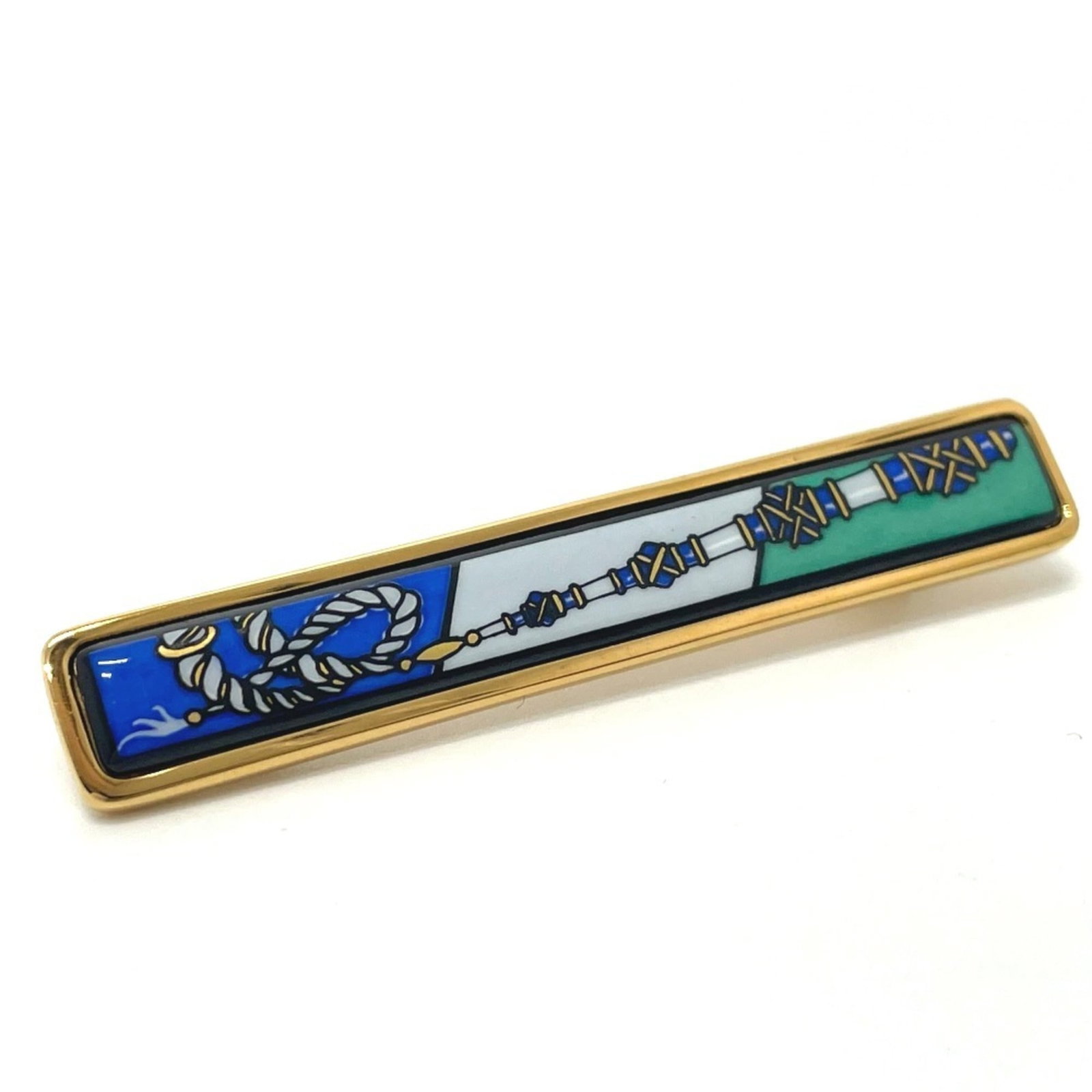 HERMES Brooch Metal: HERMES Brooch Metal Gold Hermes Brooch Metal, 1cm x 6cm, Boxed. This brooch is made of metal and features the Hermes brand. It is in like new condition, with only the faintest traces of wear. Item