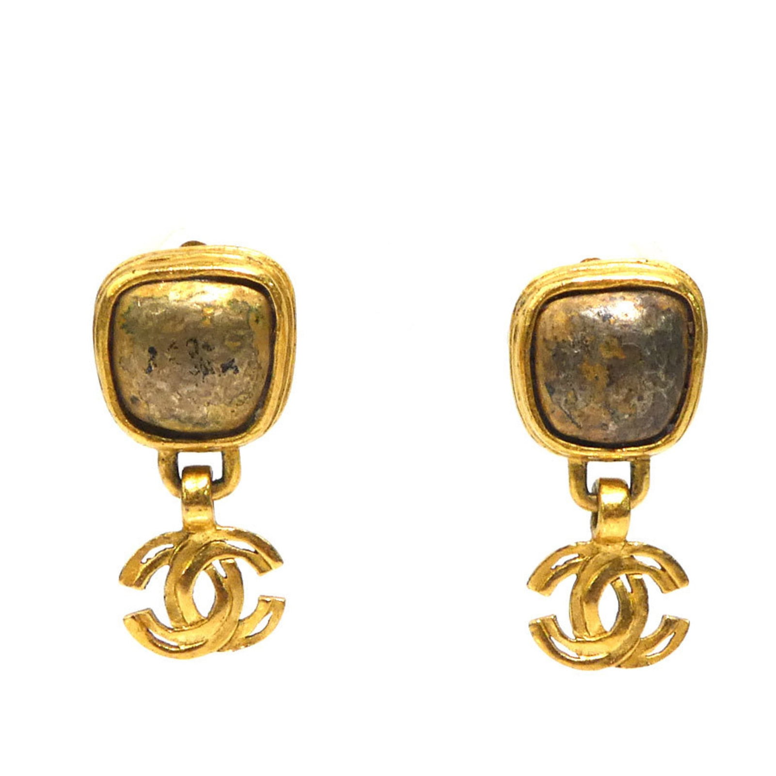 CHANEL Clip Earrings Metal: CHANEL Clip Earrings Metal Gold Clip Earrings from Chanel, featuring a metal design with visible wear and scratches. These clip earrings are in good condition, with some scuffs and dirt present, but