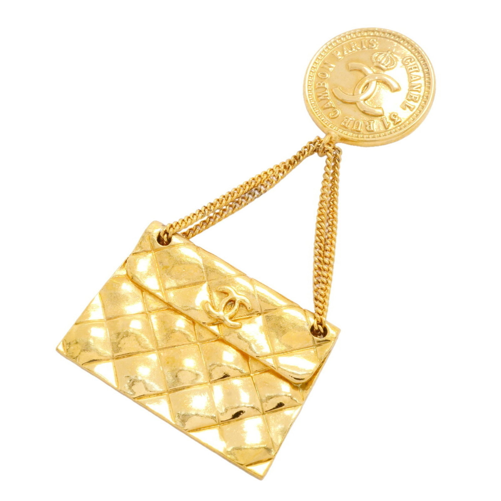 CHANEL Brooch Gold Plating: CHANEL Brooch Gold Plating Gold plating gives this CHANEL brooch a touch of luxury, while visible scratches and scuffs add a touch of worn elegance. The item measures 7.7cm x 3.44cm, making it a