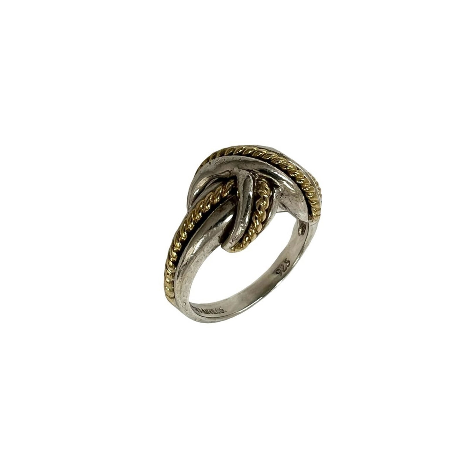 TIFFANY Band Ring Silver 925 Yellow Gold (18K): TIFFANY Band Ring Silver 925 Yellow Gold (18K) Silver 925 band ring with a touch of 18K yellow gold, adding a subtle shine to this everyday accessory. The ring bears visible signs of wear, including s