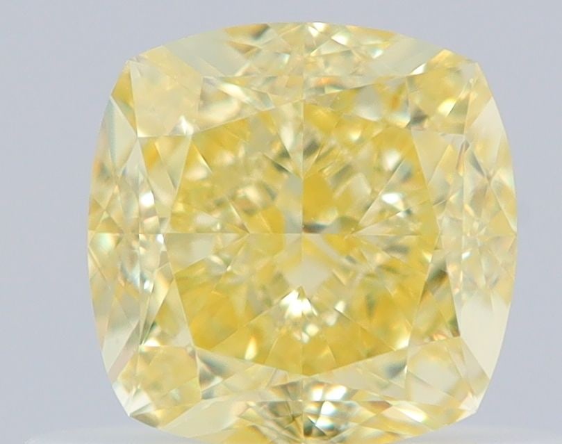 GIA Cushion Brilliant 0.66ct Fancy Yellow VVS2 - Loose Natural Diamond: GIA Cushion Brilliant 0.66ct Fancy Yellow VVS2 - Loose Natural Diamond The GIA-certified 0.66ct Fancy Yellow VVS2 diamond boasts exceptional clarity and a vibrant, sunny hue, making it a standout