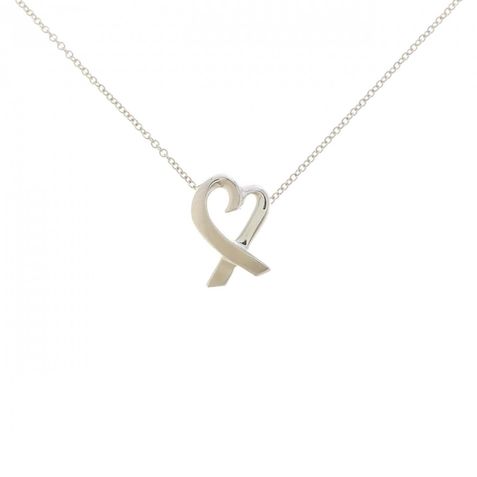 TIFFANY Silver 925: TIFFANY Silver 925 Silver 925 pendant from Tiffany's Loving Heart necklace, featuring a delicate 14.8mm x 10.6mm pendant with a 42 cm chain. Gently used, with minor signs of wear, including small scra