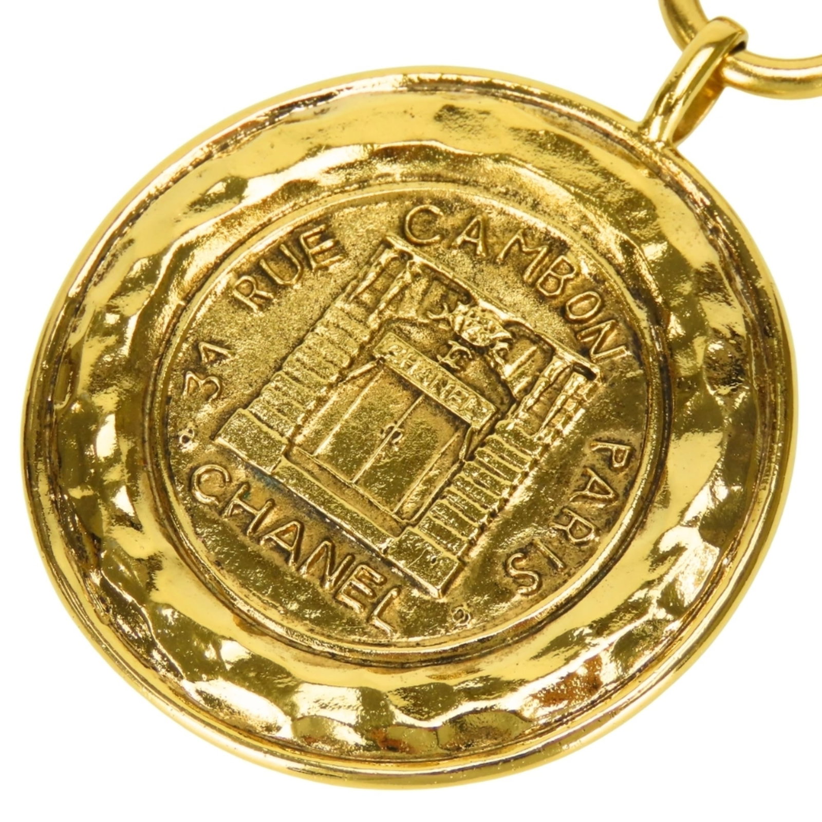 CHANEL Metal Gold: CHANEL Metal Gold Gold Metal Chanel Necklace with Visible Wear. This 74.5 cm gold metal Chanel necklace features a 51mm x 62mm pendant and is in good used condition with scratches, scuffs, and dirt