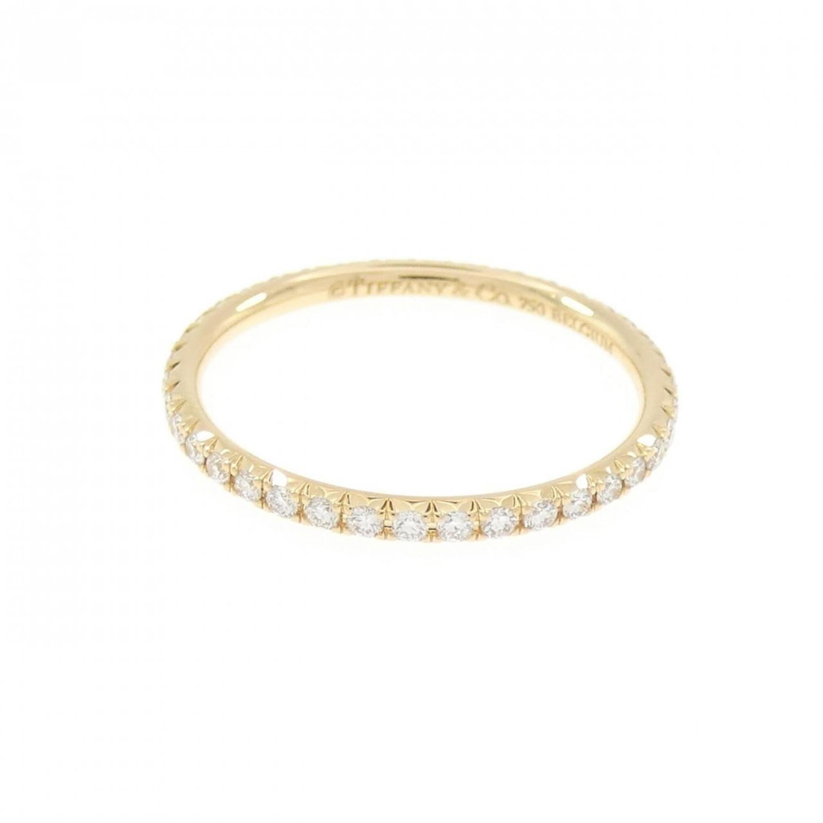 TIFFANY Band Ring Yellow Gold (18K): TIFFANY Band Ring Yellow Gold (18K) Yellow gold (18K) band ring from Tiffany's Metro line, featuring a diamond stone and a slender 1.4mm width. The ring is in very good condition, with minor signs of 