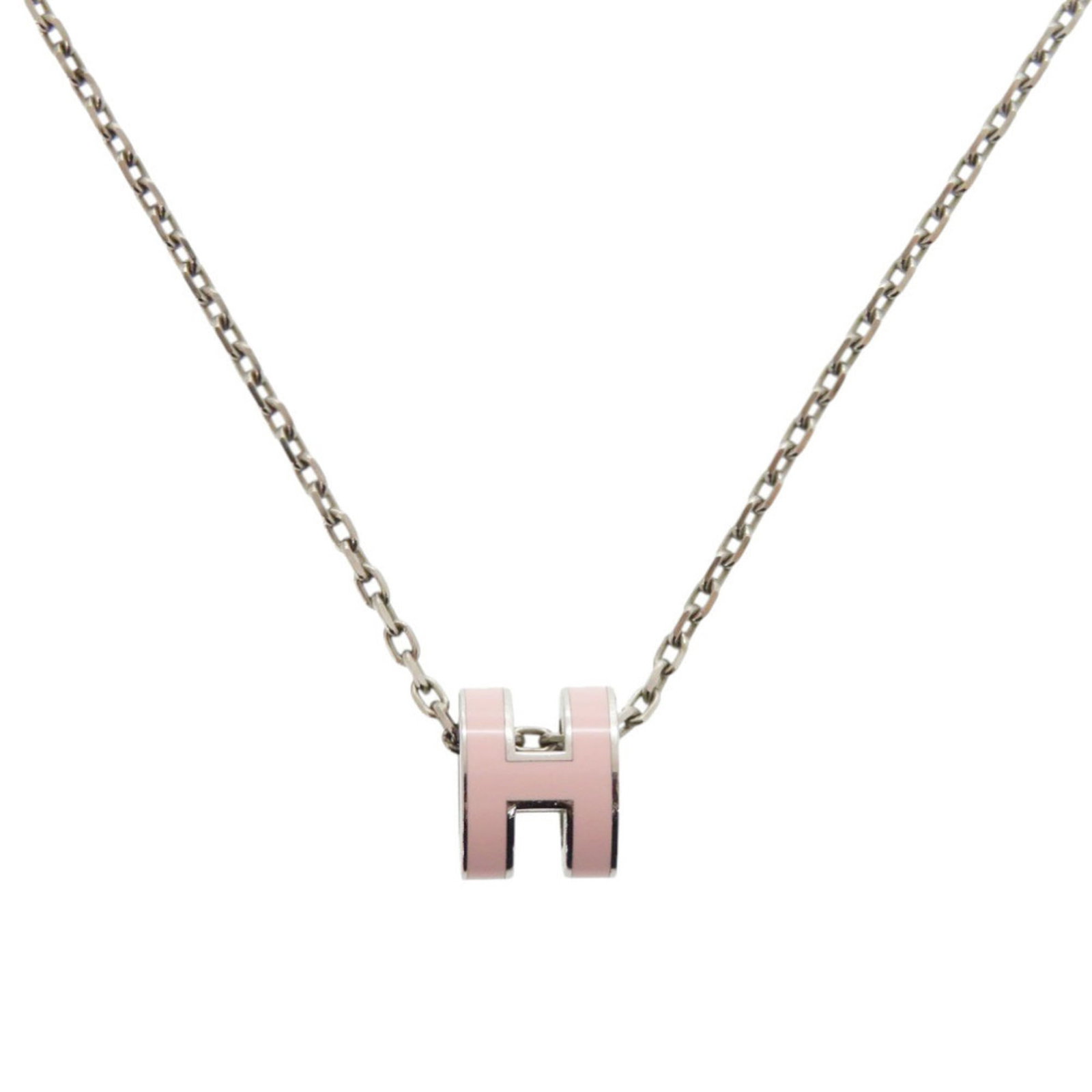 HERMES Metal Pink Silver: HERMES Metal Pink Silver The HERMES Metal Pink Silver necklace is a stylish and elegant piece, featuring a 8mm x 7mm pink and silver pendant. Gently used, this necklace boasts a very good condition wi