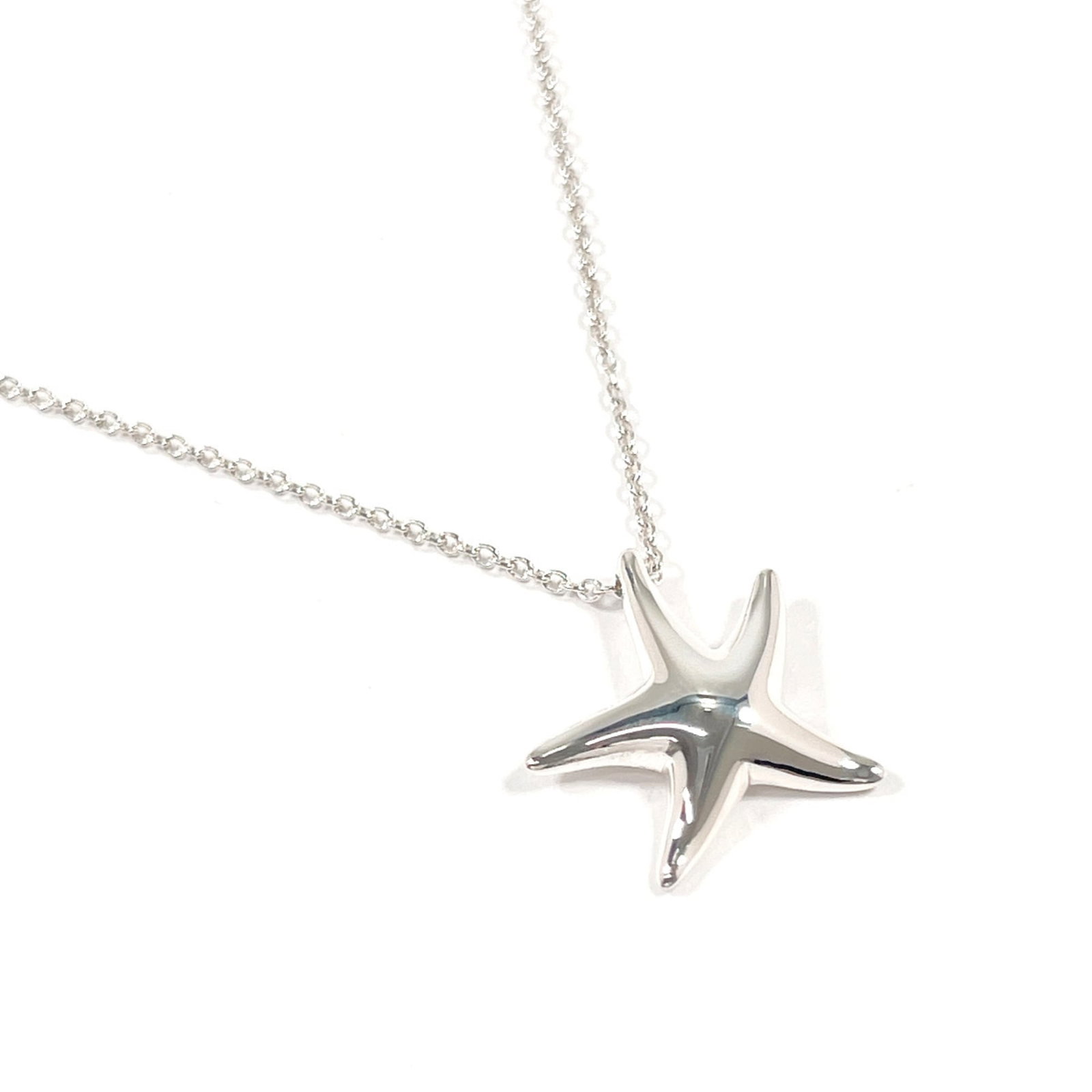 TIFFANY Silver 925: TIFFANY Silver 925 Silver 925 necklace from Tiffany's Starfish collection, featuring a 15mm x 14mm pendant in a delicate design. Made from high-quality silver, this necklace boasts a classic, elegant