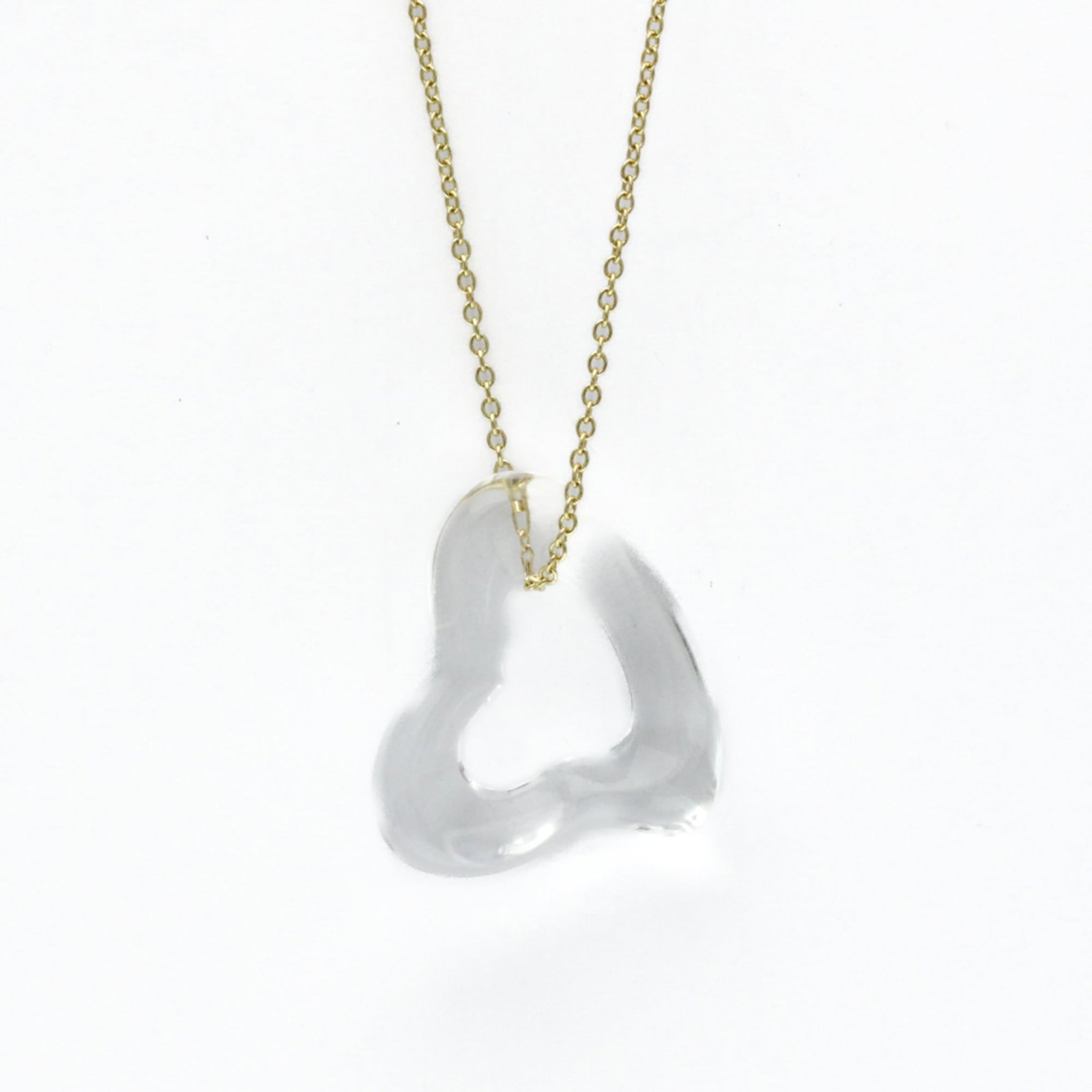 TIFFANY Yellow Gold (18K): TIFFANY Yellow Gold (18K) Yellow gold (18K) Tiffany necklace with an open heart lock crystal pendant, featuring a 43 cm chain and a 4.4g crystal stone. This gently used necklace showcases minor signs 