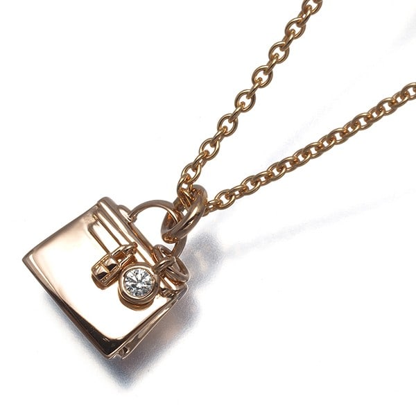 Hermes Necklace Diamond Amulette 18K 750 Rose Gold: Hermes Necklace Diamond Amulette 18K 750 Rose Gold 18k rose gold and a natural diamond come together in this elegant Amulettes necklace, crafted by the renowned French luxury brand HERMES. The 12.2 x