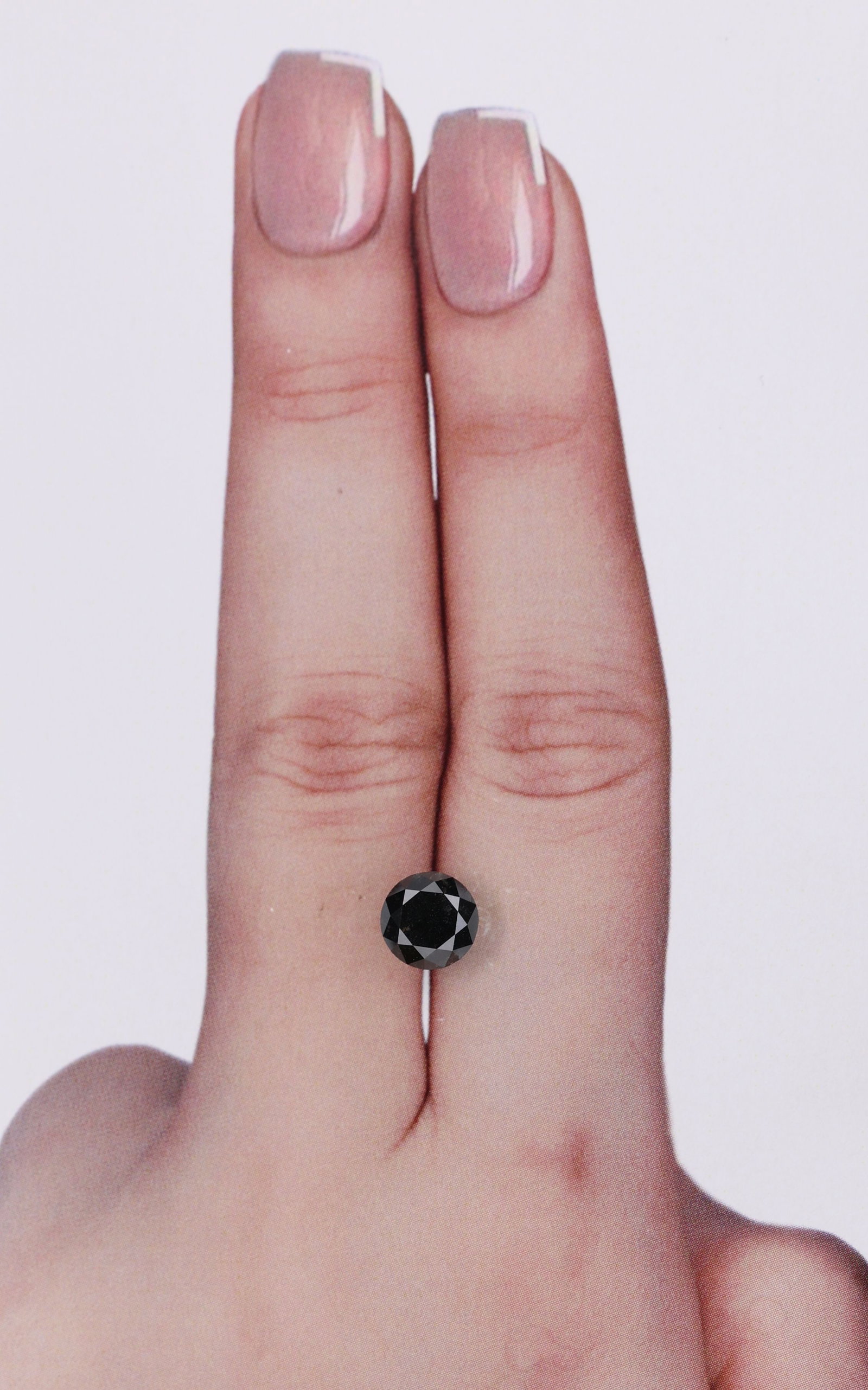 Round 1.39ct Fancy Black VVS2 - Loose Natural Diamond: Round 1.39ct Fancy Black VVS2 - Loose Natural Diamond The 1.39ct Fancy Black VVS2 diamond boasts exceptional clarity and polish, with a Fancy Black color that sets it apart from more common white