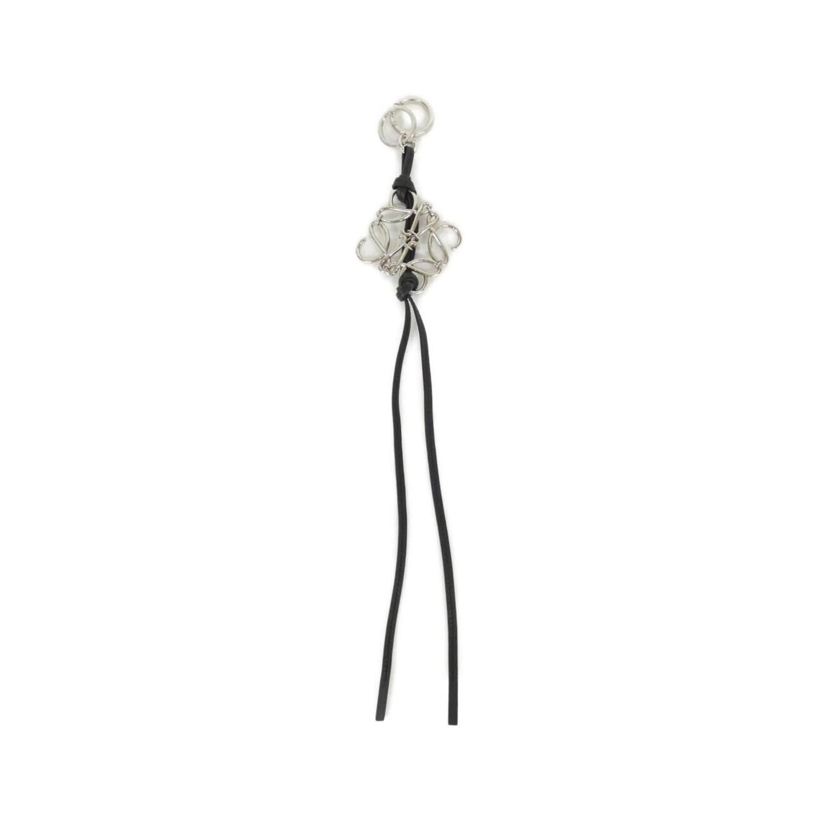 LOEWE Handbag Charm Leather: LOEWE Handbag Charm Leather This black Loewe handbag charm is crafted from high-quality calfskin leather, featuring a sleek and sophisticated design. Gently used with minor signs of wear, the charm