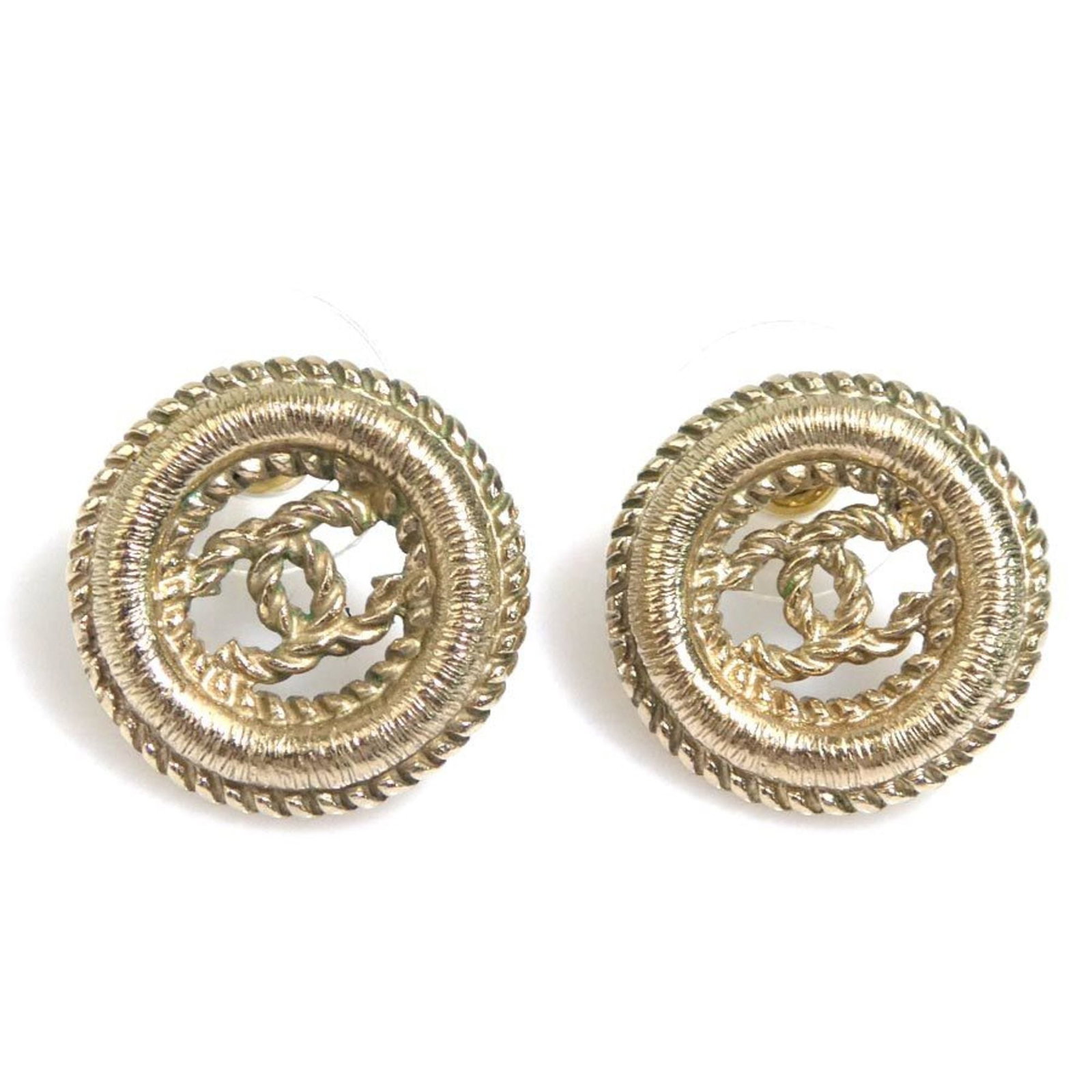 CHANEL Stud Earrings Metal: CHANEL Stud Earrings Metal Gold Stud Earrings from Chanel, bearing a signature, are up for auction. These metal earrings feature a classic design and are made from gold, with visible scratches and