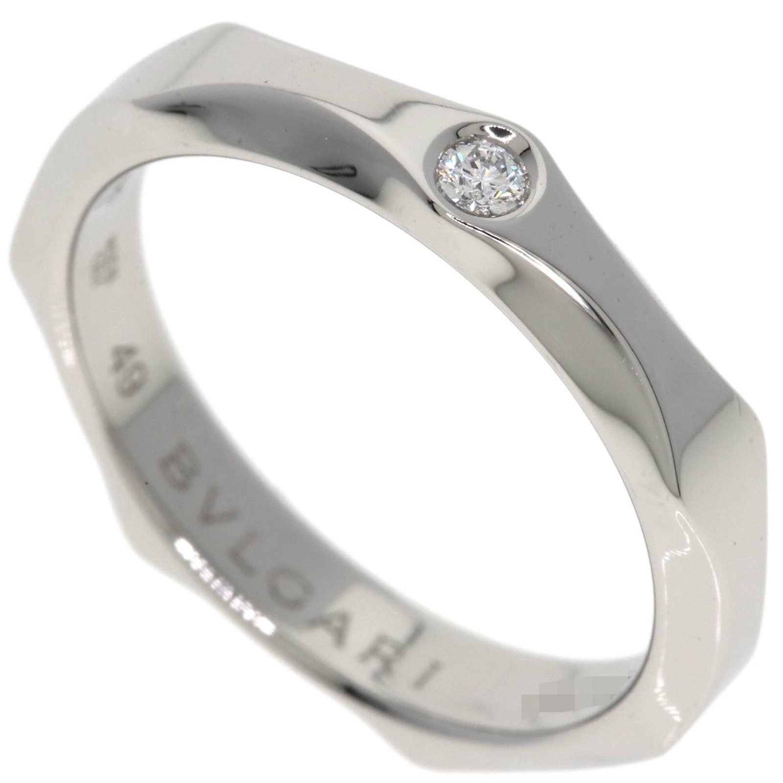 BVLGARI Band Ring Platinum 950: BVLGARI Band Ring Platinum 950 Platinum 950 BVLGARI Band Ring, a sleek and sophisticated design, is available for sale. This gently used band ring features a silver finish and bears a signature, addin