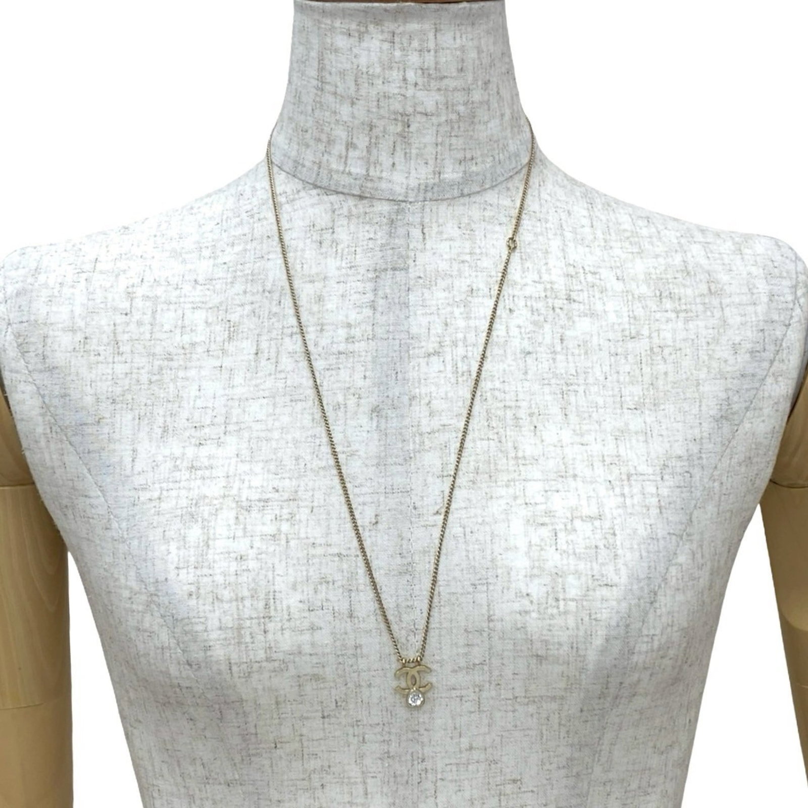 CHANEL Gold Plating: CHANEL Gold Plating Gold plating adds a touch of luxury to this Chanel necklace, featuring a 15mm x 15mm pendant with a gold plating finish. The necklace has a 62 cm / 24.4'' circumference and bears