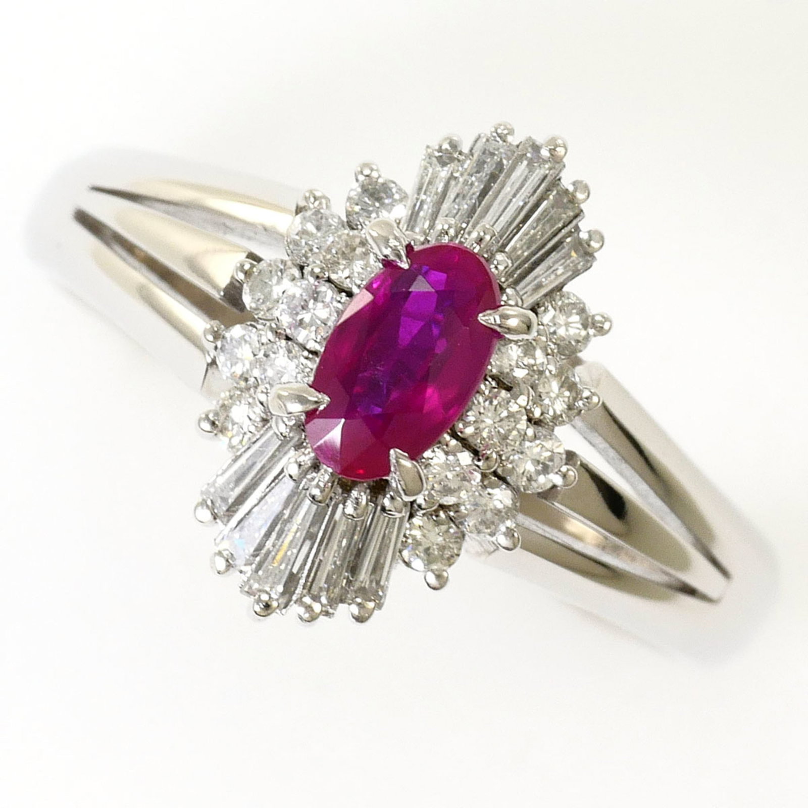 Band Ring Platinum 900: Band Ring Platinum 900 Platinum 900 band ring features a 12mm wide band with a diamond and ruby stone, set in a high-quality platinum setting. Made from 900 platinum metal, this ring boasts a sleek an