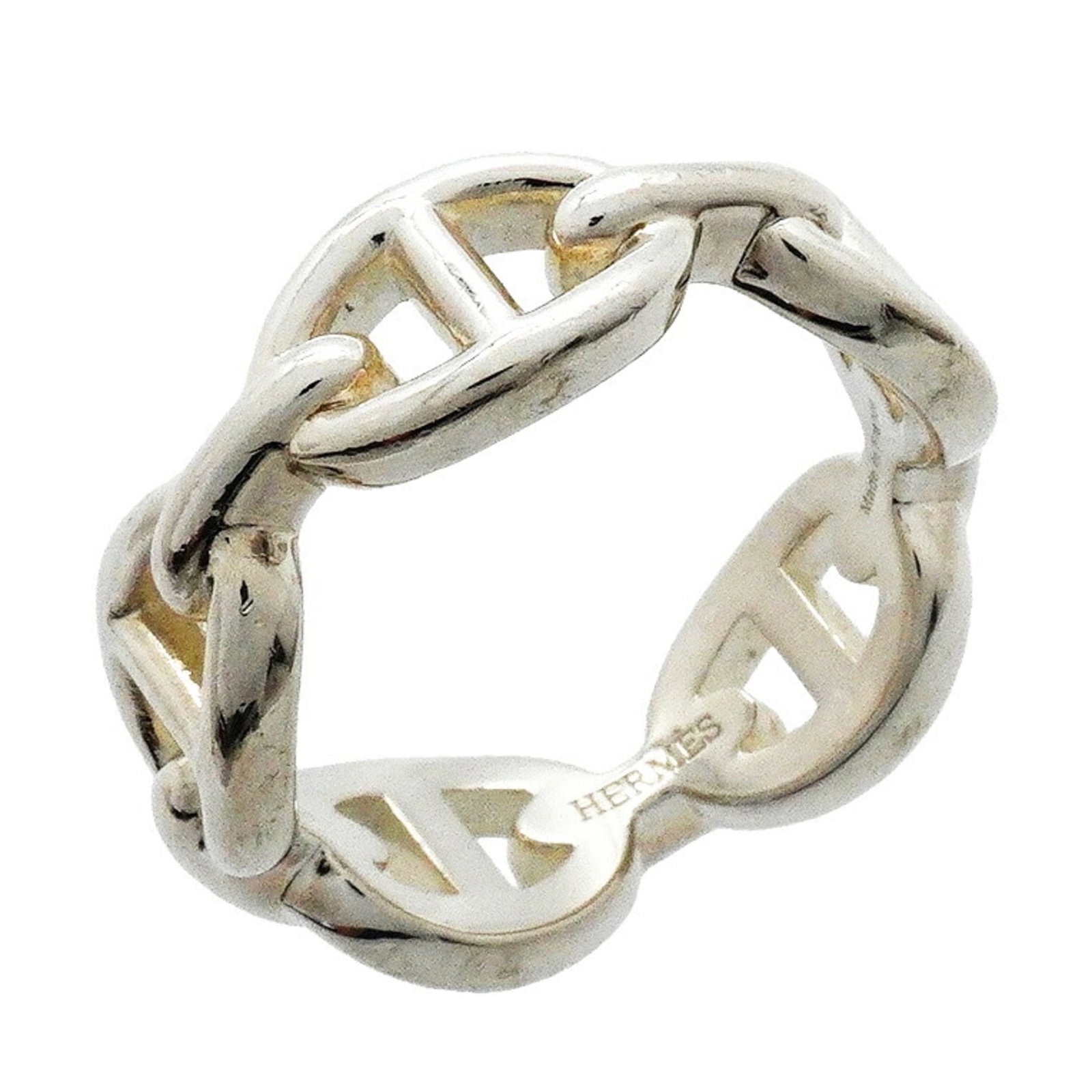 HERMES Band Ring Silver 925: HERMES Band Ring Silver 925 Silver 925 band ring from Hermes, featuring a classic design with visible scratches and scuffs. The ring is in good used condition, bearing a signature, and is made from