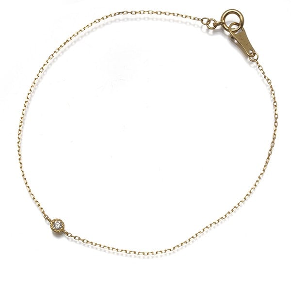 Agete Bracelet Diamond 0.03Ct Solitaire Milgrain 18K 750 Yellow Gold: Agete Bracelet Diamond 0.03Ct Solitaire Milgrain 18K 750 Yellow Gold A 0.03ct diamond solitaire is set in a delicate 18k yellow gold milgrain bracelet, adding a touch of elegance to any outfit. The 16