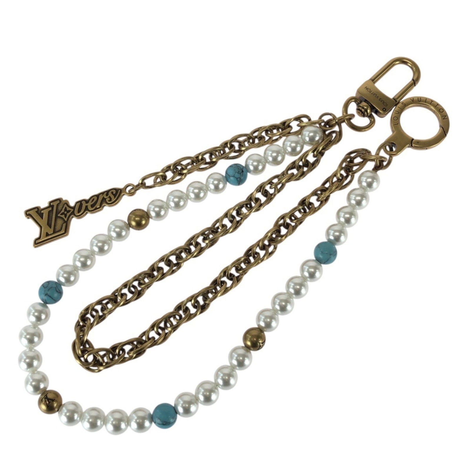 LOUIS VUITTON Handbag Charm Metal: LOUIS VUITTON Handbag Charm Metal Metal charm from Louis Vuitton, bearing the iconic brand's signature blue, gold, and white colors. The charm is made of metal and has a very good condition, with