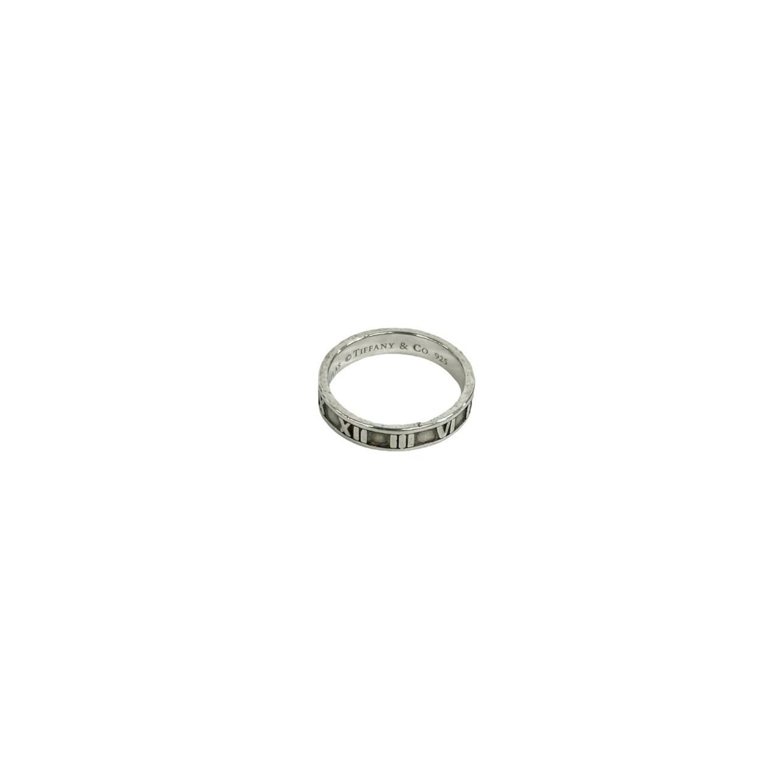 TIFFANY Band Ring Silver 925: TIFFANY Band Ring Silver 925 Silver 925 band ring from Tiffany features a sleek, modern design. The ring bears visible signs of wear, including scratches and scuffs, but remains fully functional. Sold