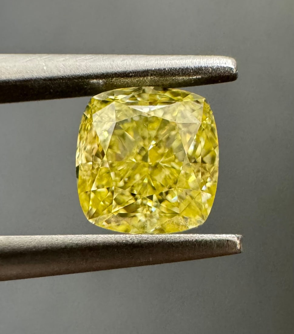 GIA Cushion Brilliant 0.67ct Fancy Yellow VVS1 - Loose Natural Diamond: GIA Cushion Brilliant 0.67ct Fancy Yellow VVS1 - Loose Natural Diamond GIA certified, this 0.67ct Fancy Yellow VVS1 diamond boasts exceptional clarity and a vibrant, sunny hue. Its EX polish and VG sy