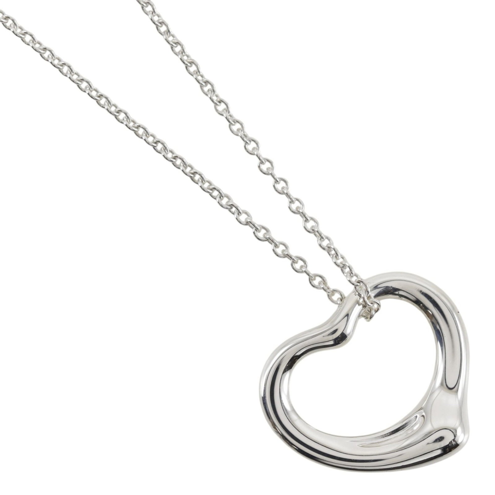 TIFFANY Silver 925: TIFFANY Silver 925 Silver 925 Tiffany Necklace, 40.8 cm / 16.06'' circumference, features a 12mm x 15mm pendant. Gently used with minor signs of wear, this necklace bears a Tiffany signature. Item Spe