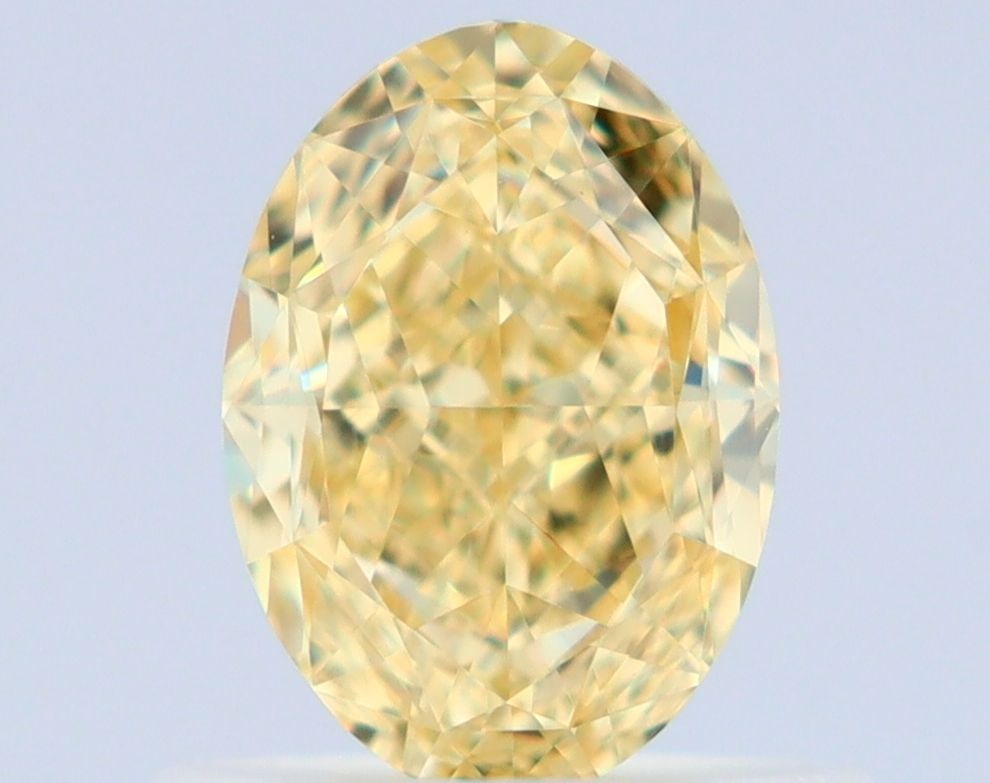 GIA Oval 0.75ct Fancy Yellow VVS1 - Loose Natural Diamond: GIA Oval 0.75ct Fancy Yellow VVS1 - Loose Natural Diamond GIA Oval 0.75ct Fancy Yellow VVS1 - Loose Natural Diamond. This stunning 0.75ct Fancy Yellow diamond boasts exceptional clarity and color,