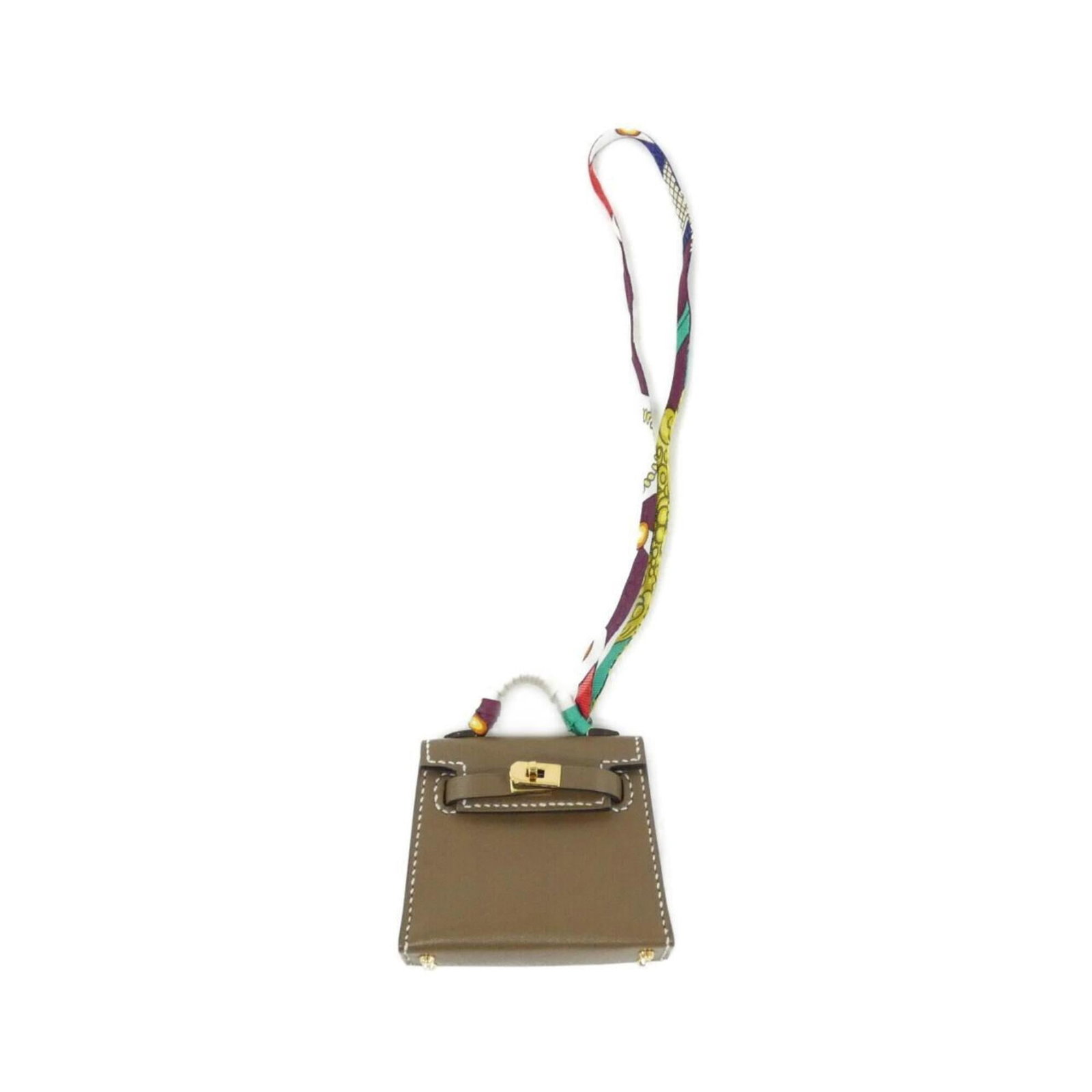 HERMES Handbag Charm Silk Tadelakt Leather: HERMES Handbag Charm Silk Tadelakt Leather Silk and Tadelakt leather come together in this elegant Hermes handbag charm, featuring a beige and Etoupe gray color combination. The charm measures 55mm x