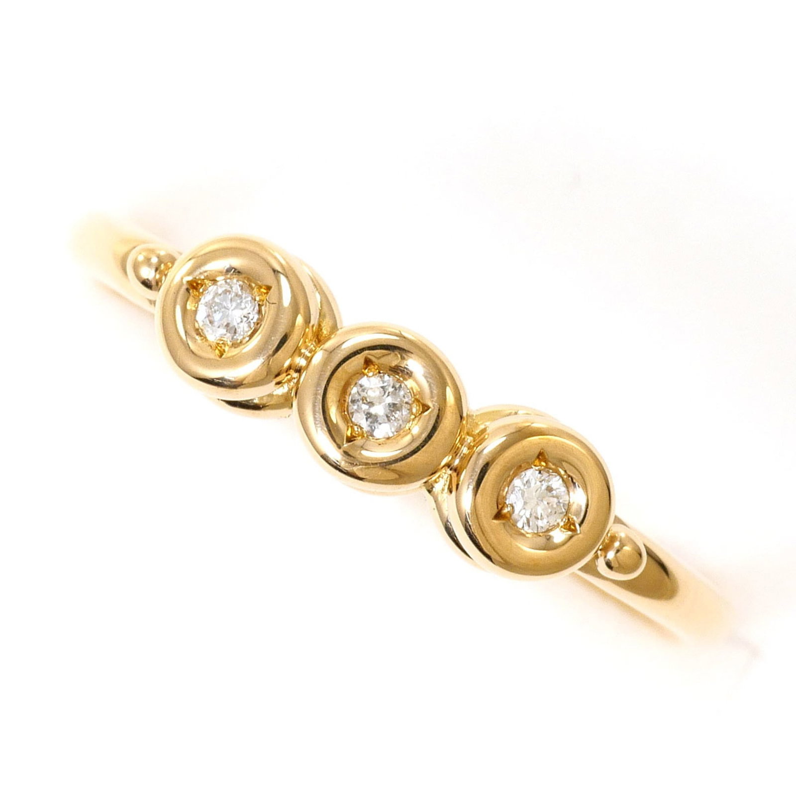 Band Ring Yellow Gold (18K): Band Ring Yellow Gold (18K) Yellow gold band ring with a 4mm diamond stone, crafted from 18K gold for a touch of elegance. This like-new used ring boasts a slender 4mm width and weighs 2.4g, making it