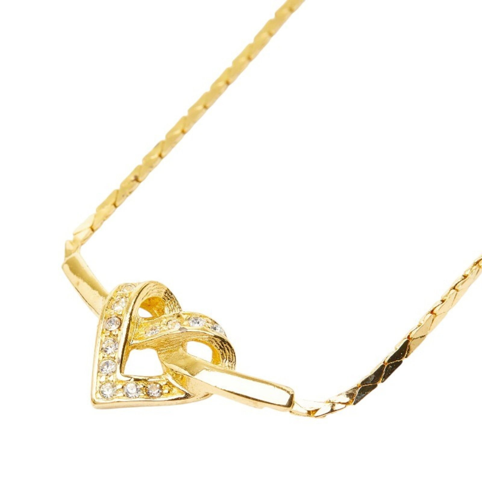 CHRISTIAN DIOR Gold Plating Rhinestone: CHRISTIAN DIOR Gold Plating Rhinestone Gold Plating Rhinestone Necklace from Christian Dior features a striking gold plating and rhinestone design. The 44 cm necklace boasts a 11.9mm x 24mm pendant,